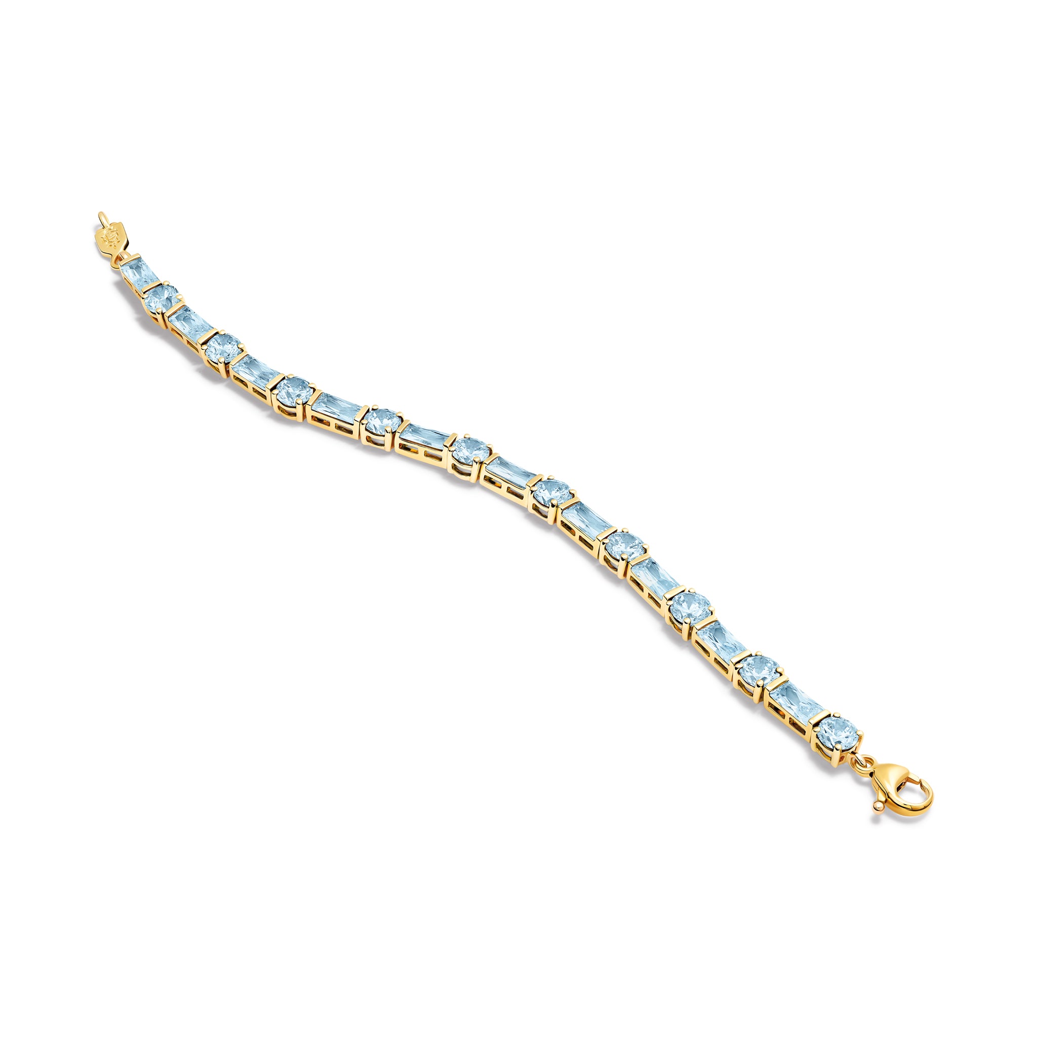 Handcrafted yellow gold tennis bracelet with baguette cut blue topaz gemstones. 