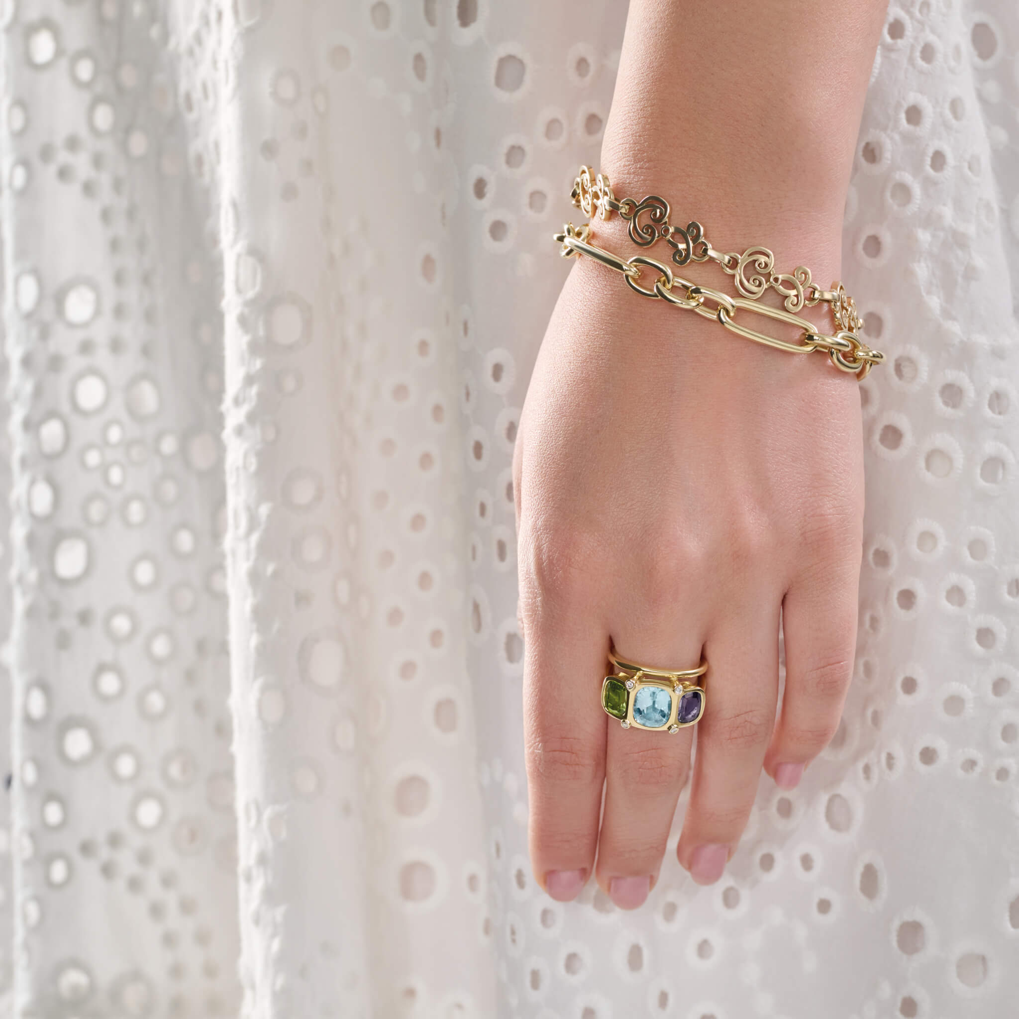 Handcrafted 18ct precious metal ring featuring rectangular shaped precious stones.