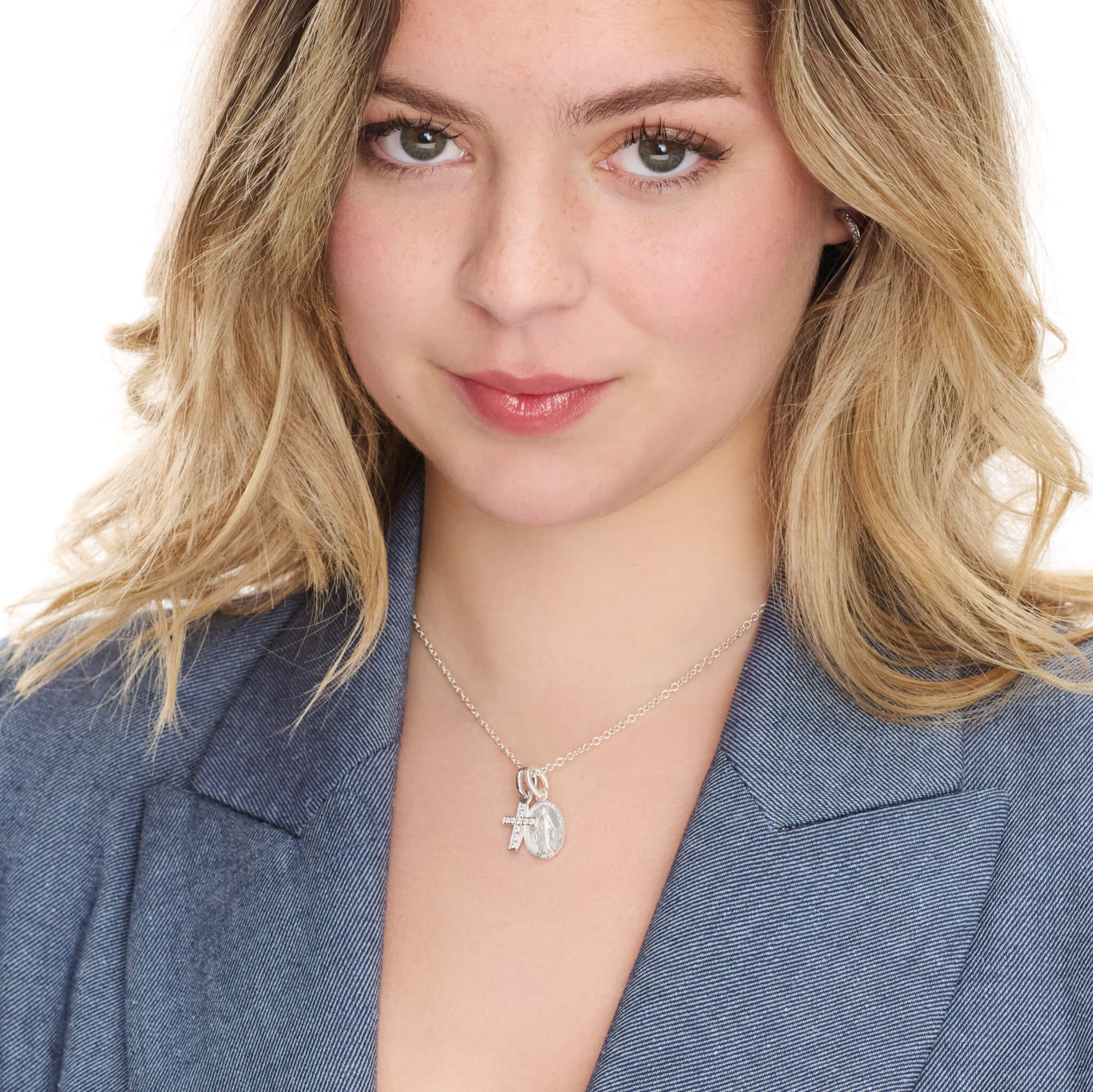 Handcrafted round precious metal necklace pendant featuring an engraving of  Saint Marie Miraculeuse, with a loop at the top for chain attachment.