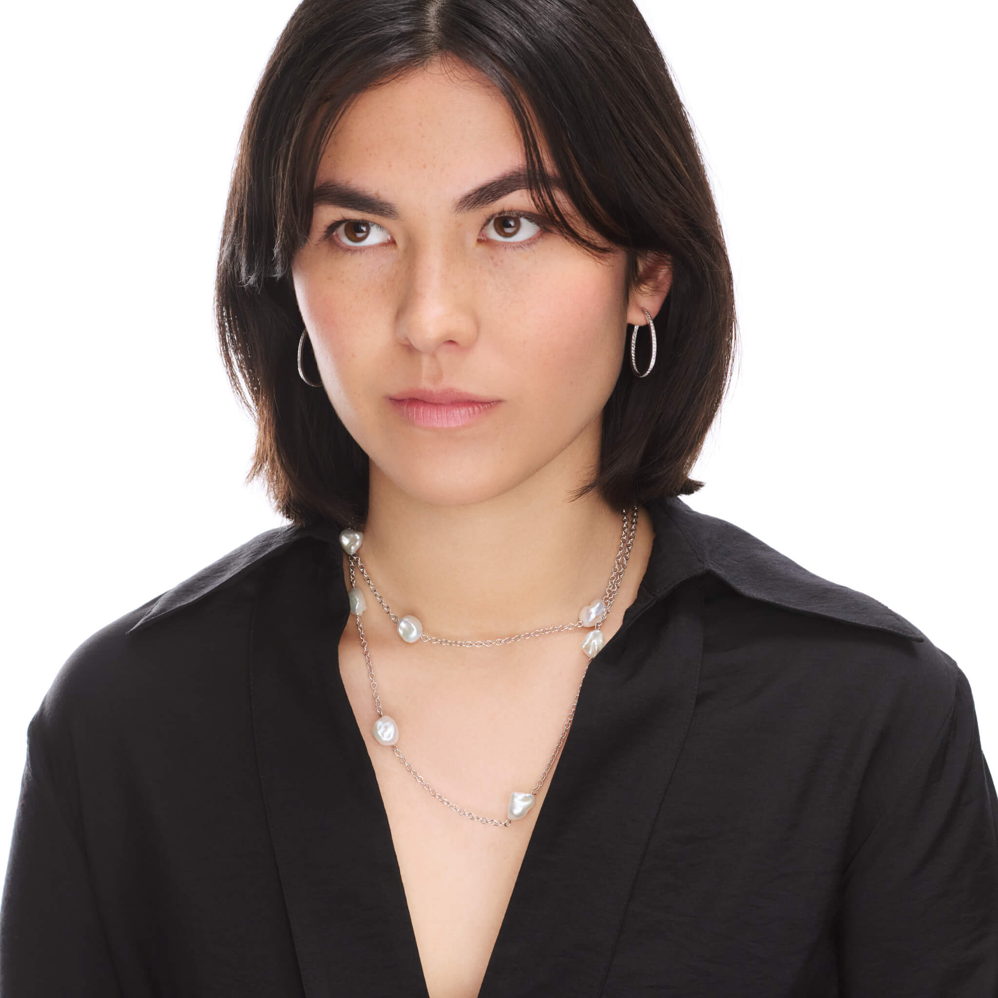 Handcrafted gold necklace featuring six baroque pearls on a gold chain.