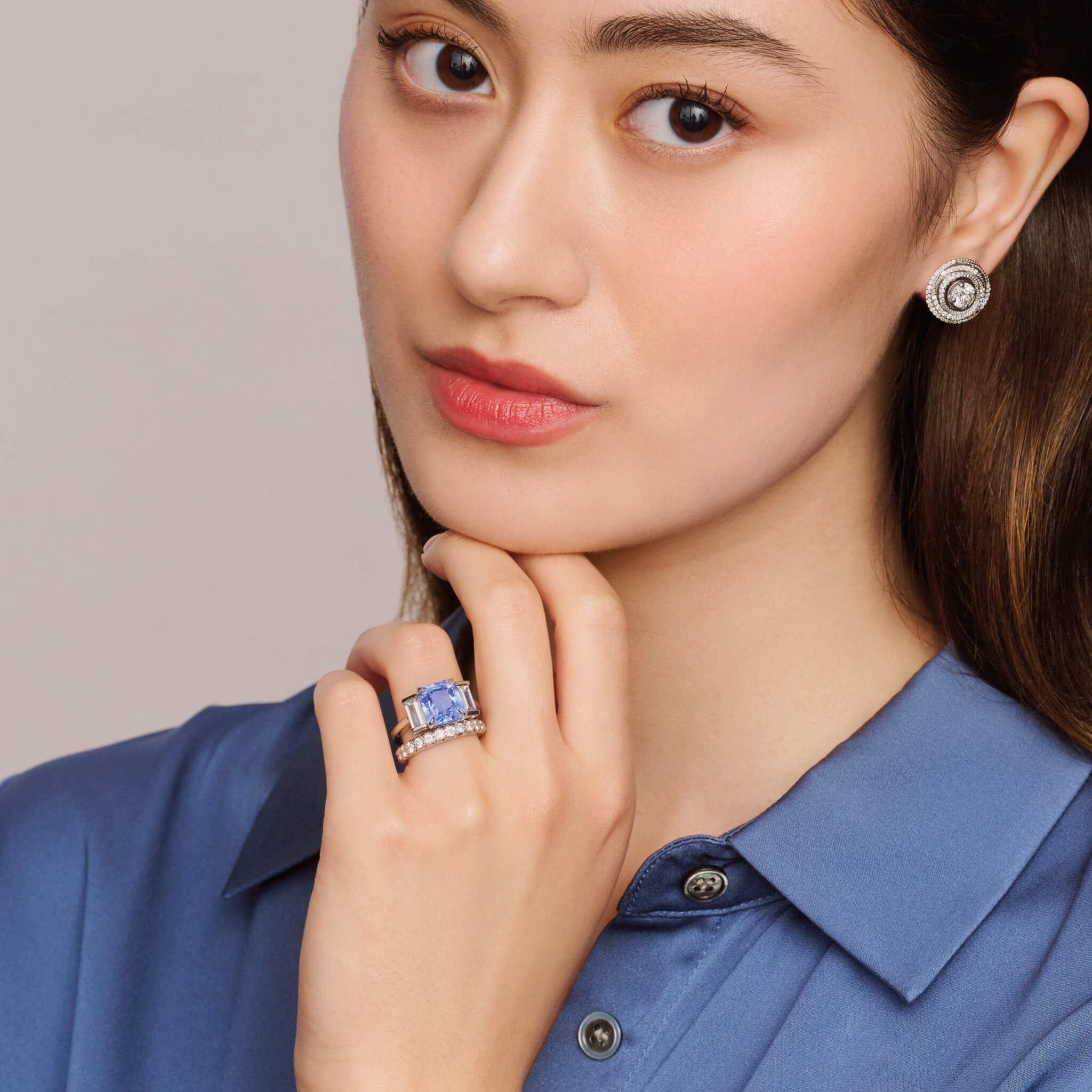 Model wearing a handcrafted 18ct white gold eternity ring with diamonds.