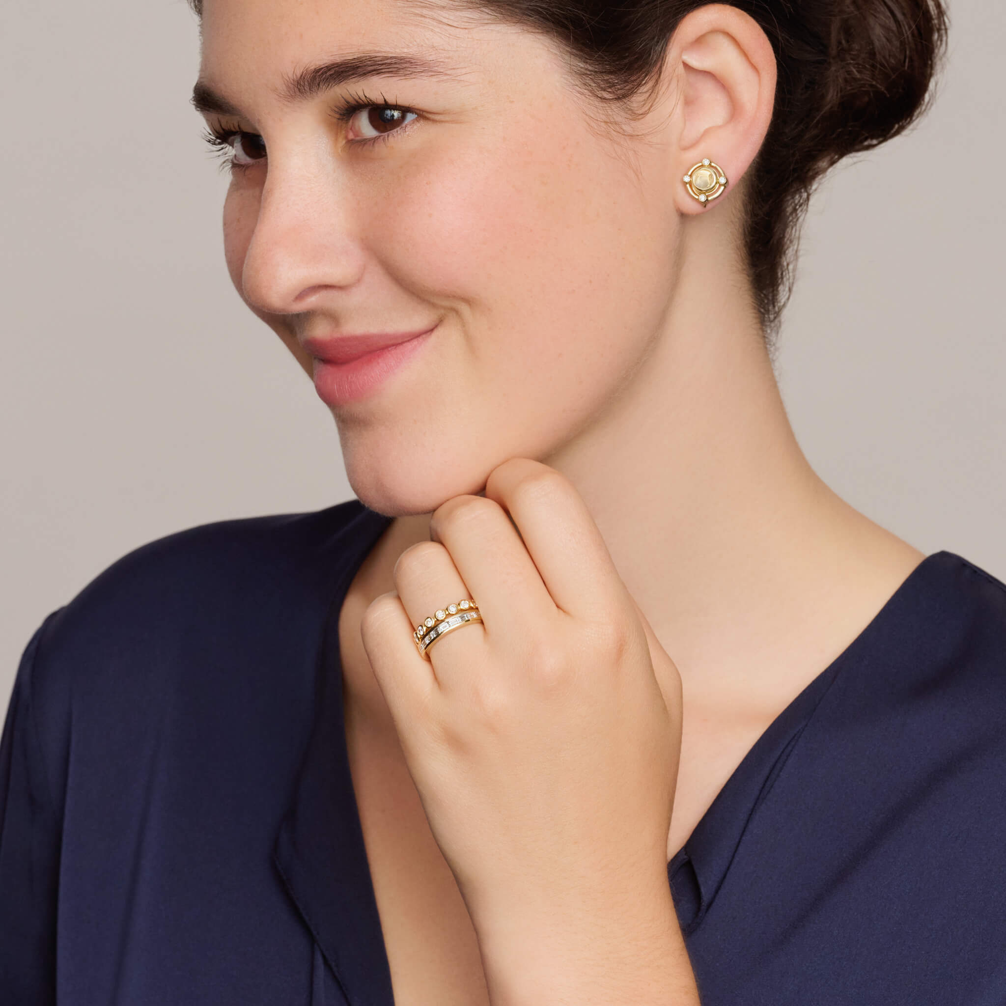 Model wears Natasha half-eternity ring in precious metal with diamonds by Cassandra Goad