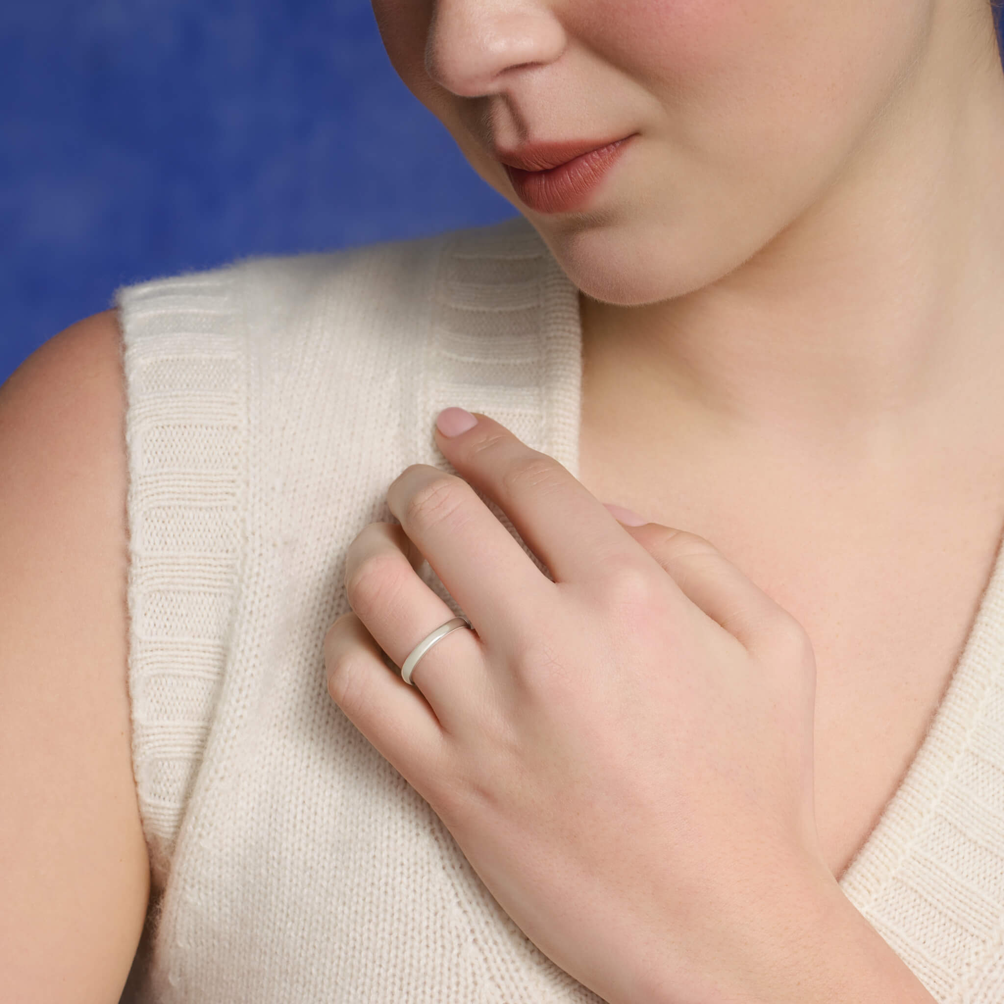 Model wearing a handcrafted precious metal wedding band with a width of 3mm.
