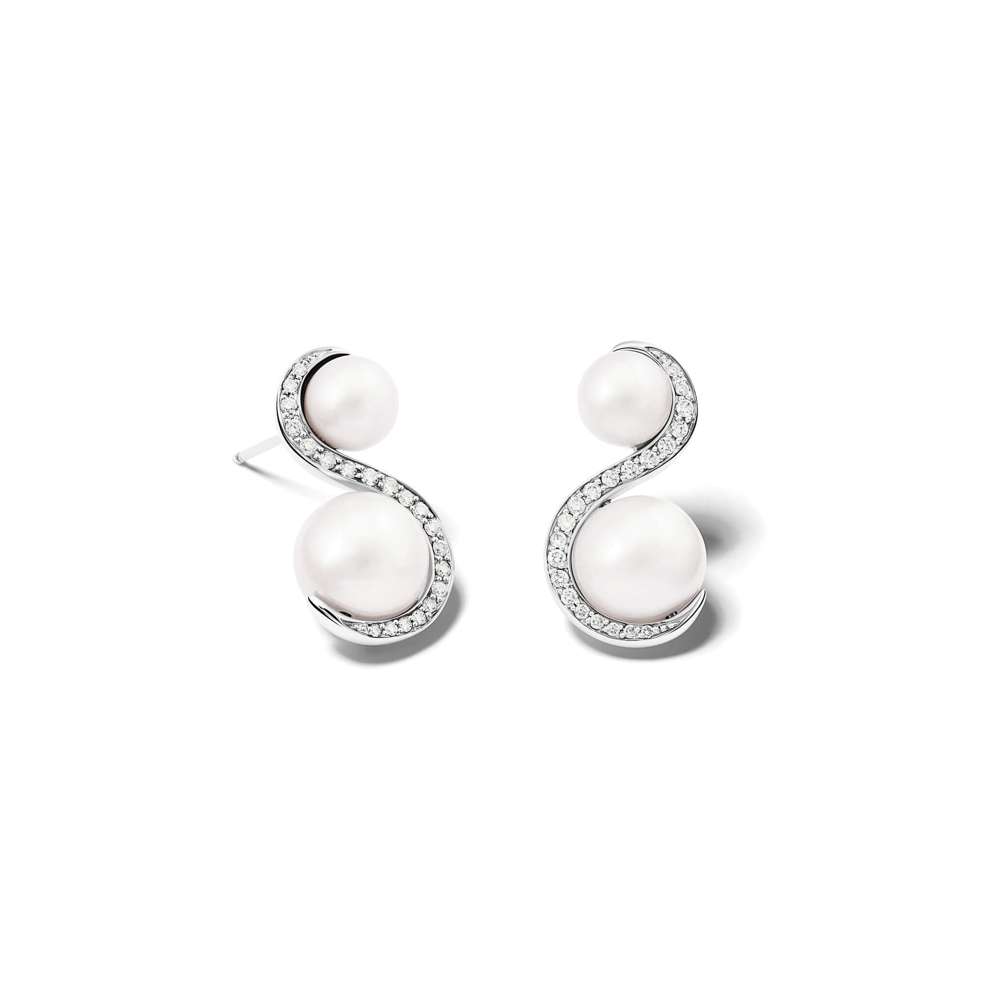 Handcrafted 18ct white gold earrings featuring an 's' shape linking the pearls with diamonds.