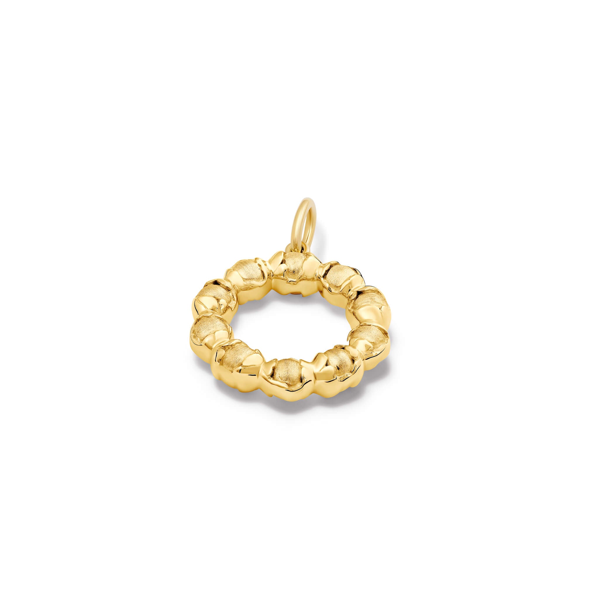Handcrafted yellow gold necklace pendant featuring beads wrapped in leaves.
