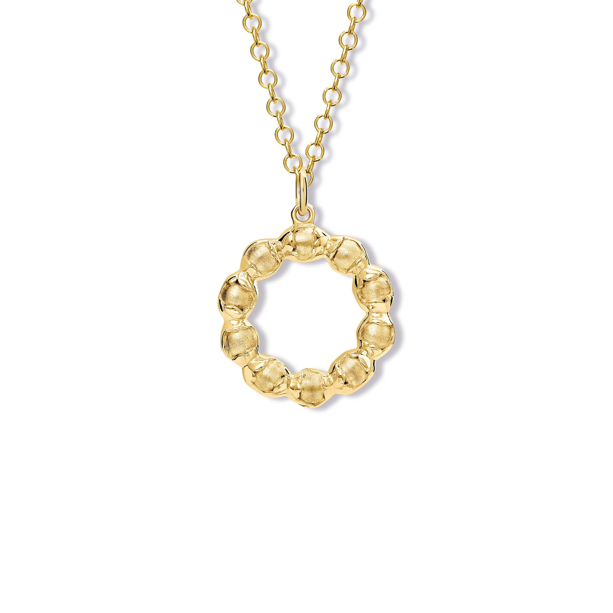 Handcrafted yellow gold necklace pendant featuring beads wrapped in leaves.
