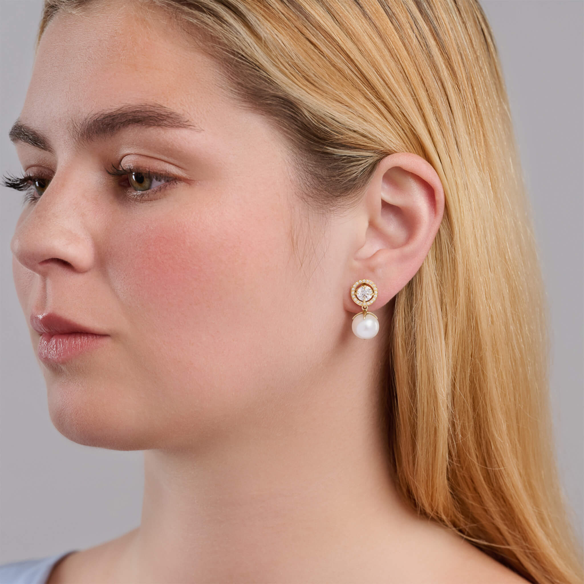 Handcrafted 18ct yellow gold earring halos featuring a circular shape with diamonds.