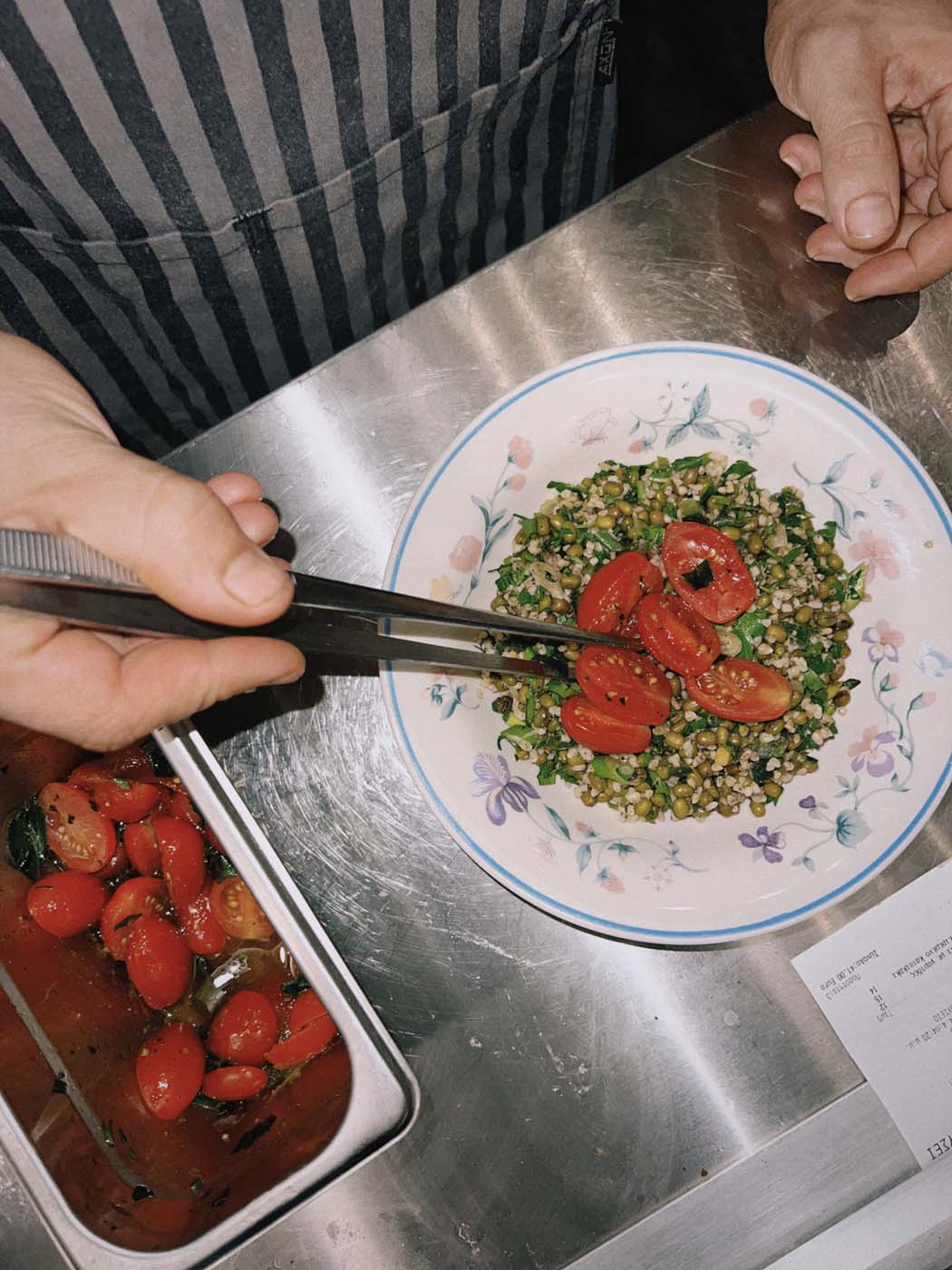 To Rini restaurant in Athens preparing tomato salad.