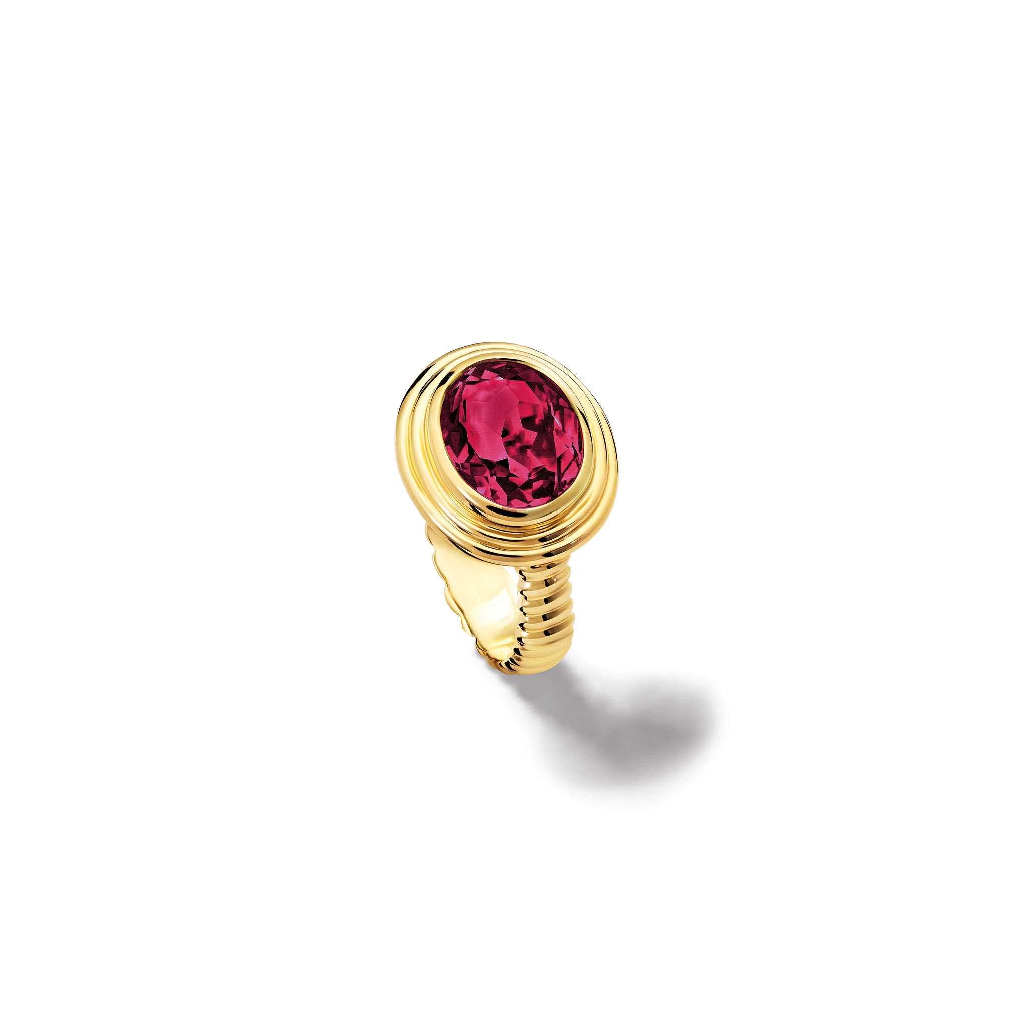 Handcrafted yellow gold ring featuring a prominent oval rhodolite garnet, birthstone of January.