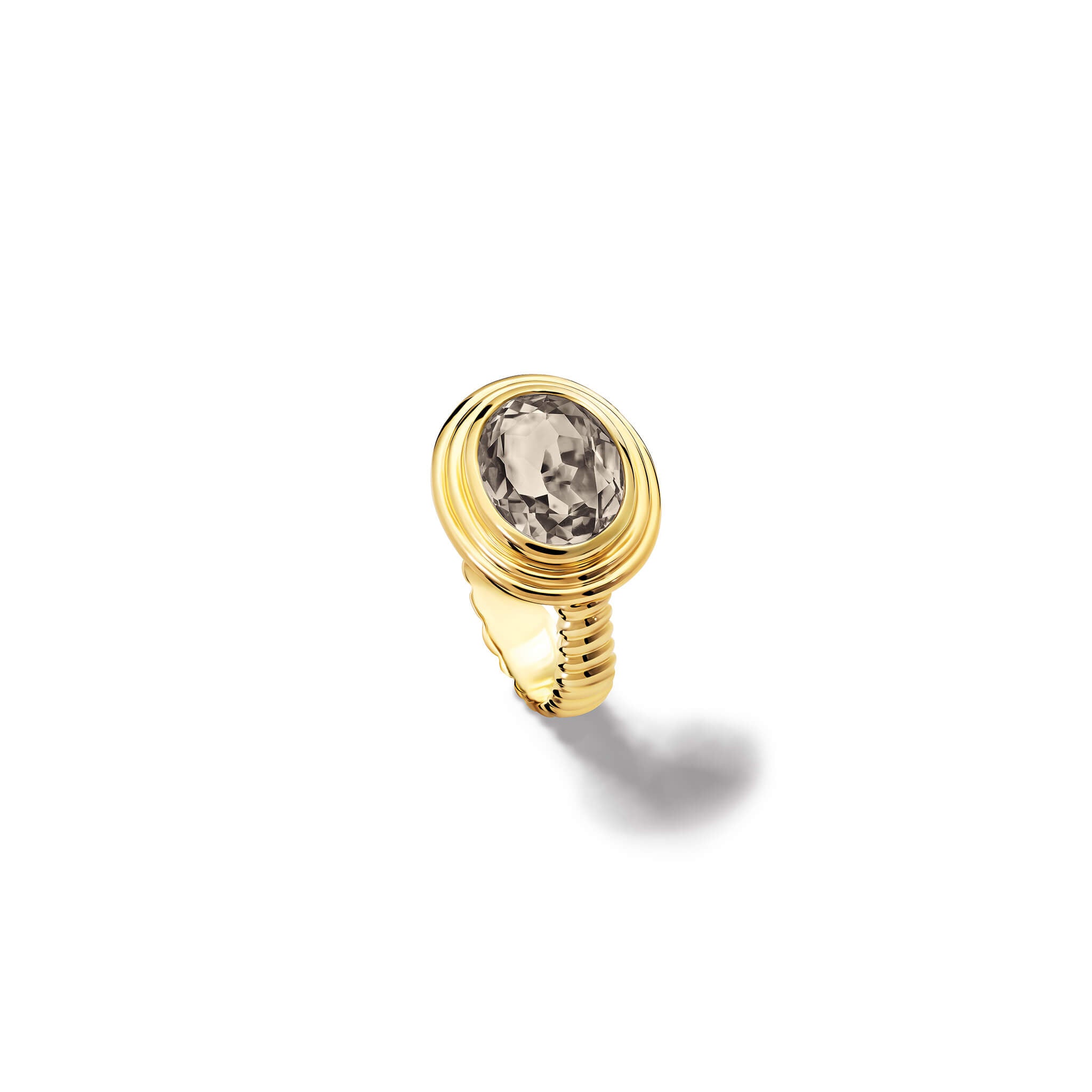 Handcrafted yellow gold ring featuring a prominent oval smoky quartz