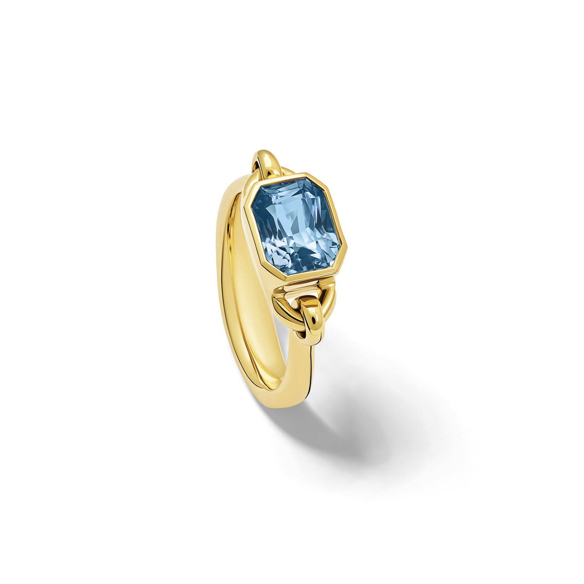 Handcrafted Baguette ring in 18ct yellow gold with emerald-cut blue sapphire, September birthstone.