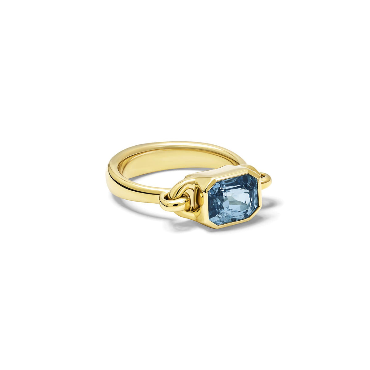 Handcrafted Baguette ring in 18ct yellow gold with emerald-cut blue sapphire, September birthstone.