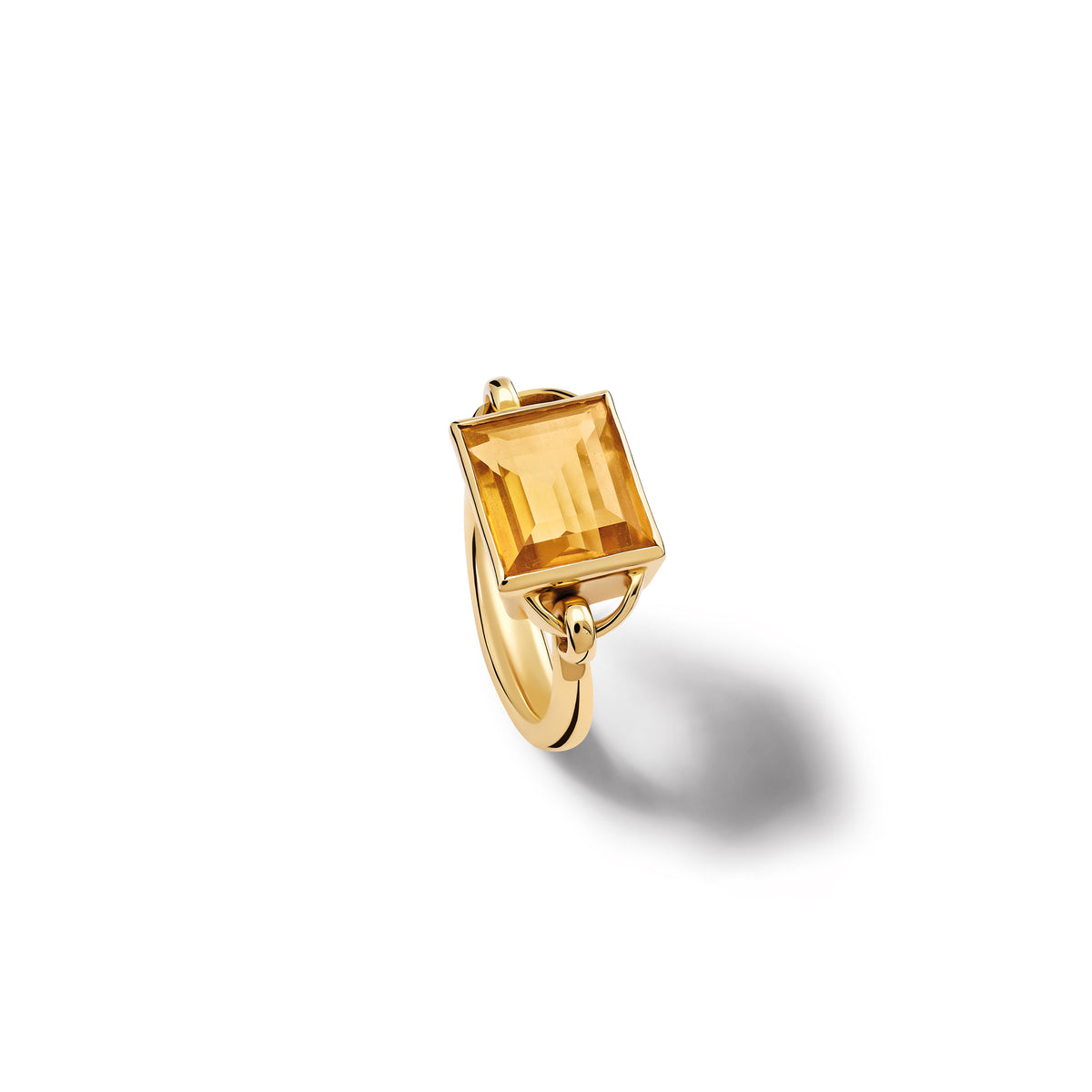 Handcrafted yellow gold ring featuring a central baguette cut citrine, birthstone of November.