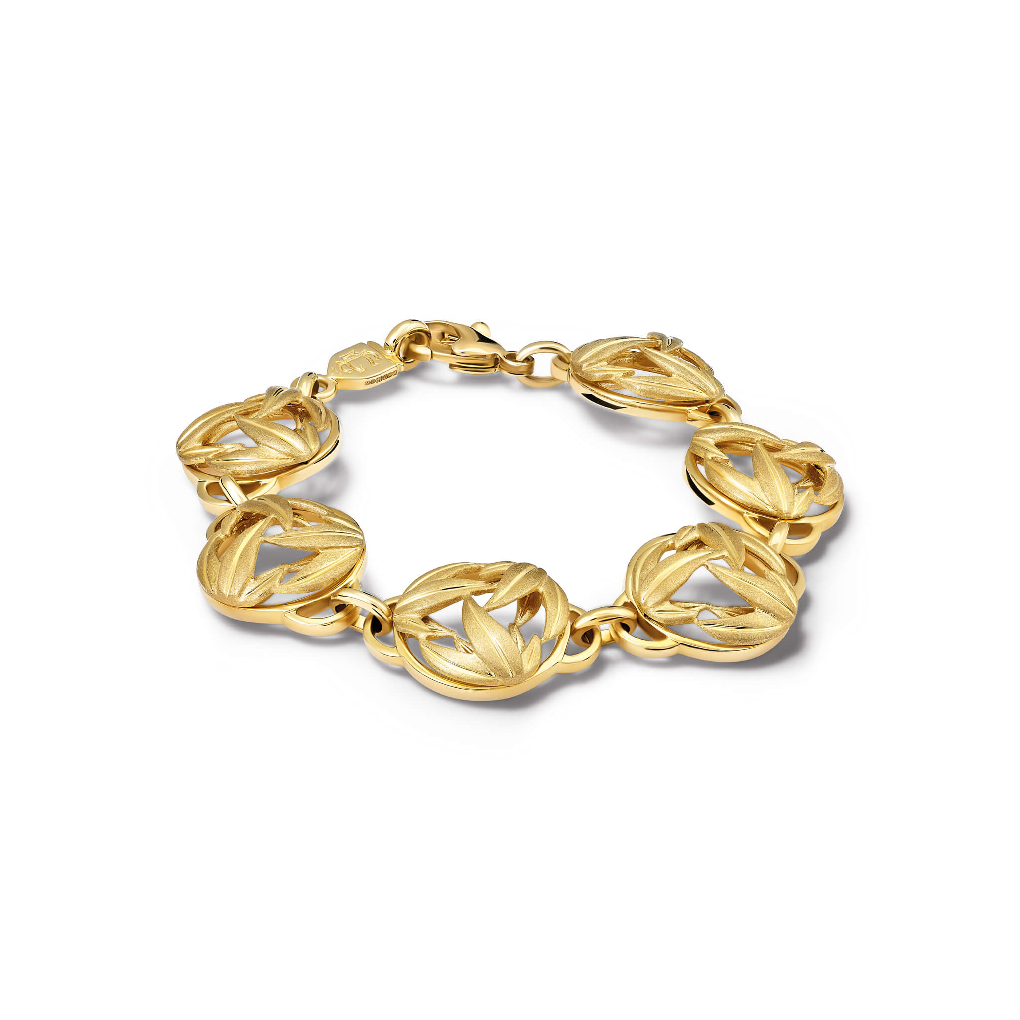 Handcrafted yellow gold bracelet with circular sculpted links featuring a brushed leaf motif