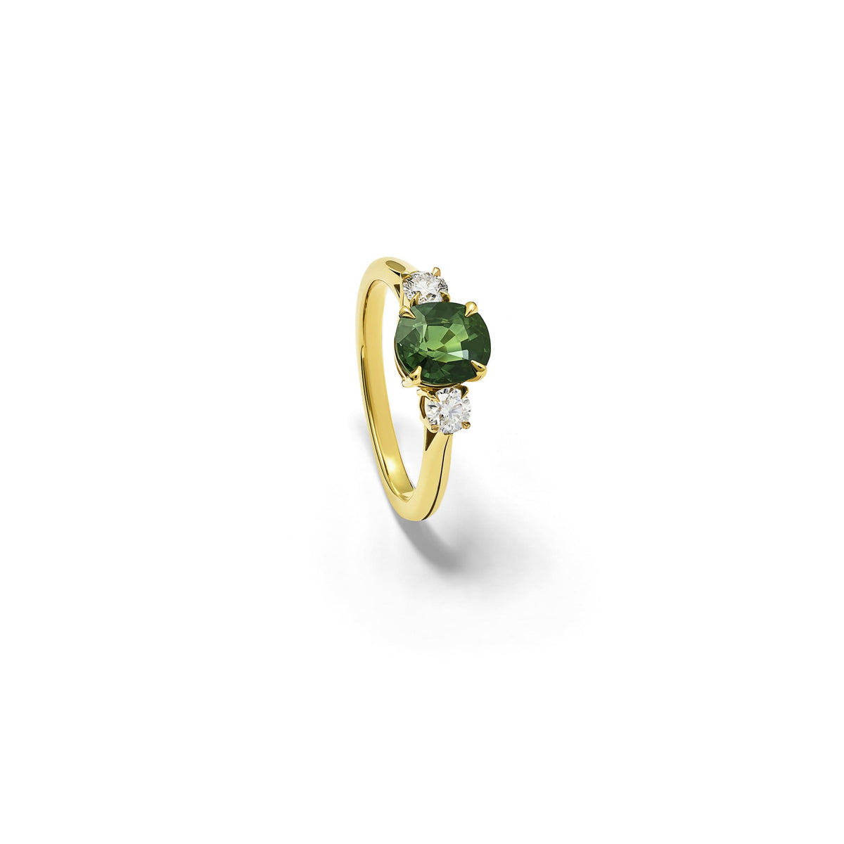 Handcrafted Delilah engagement ring in 18ct yellow and white gold with green sapphire and diamond. September birthstone.