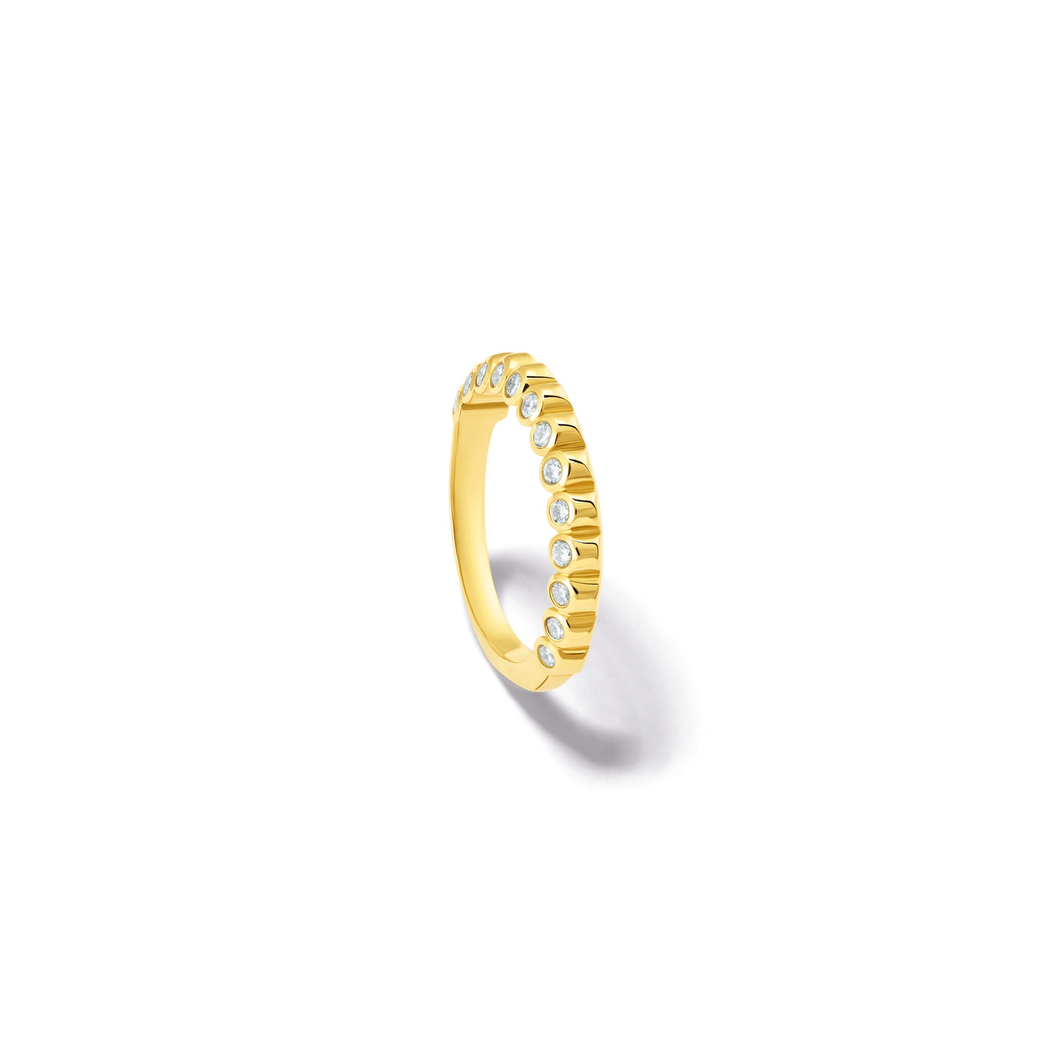 Handcrafted 18ct yellow gold eternity ring with diamonds on the side of the shank and smooth ridges along the top.
