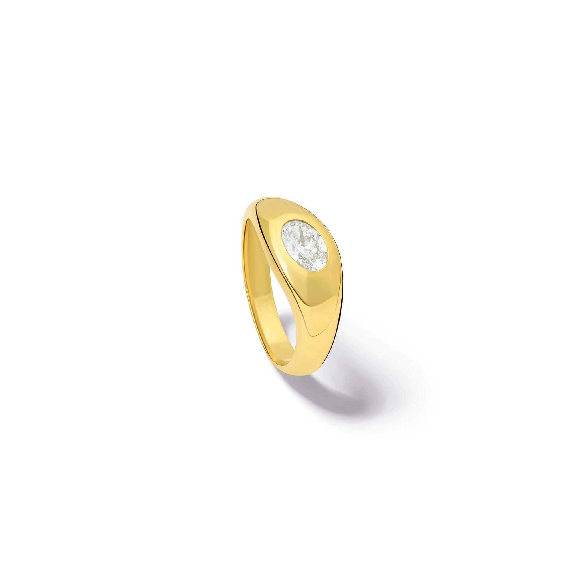 Handcrafted yellow gold ring with a slight teardrop design set with an oval facetted diamond.