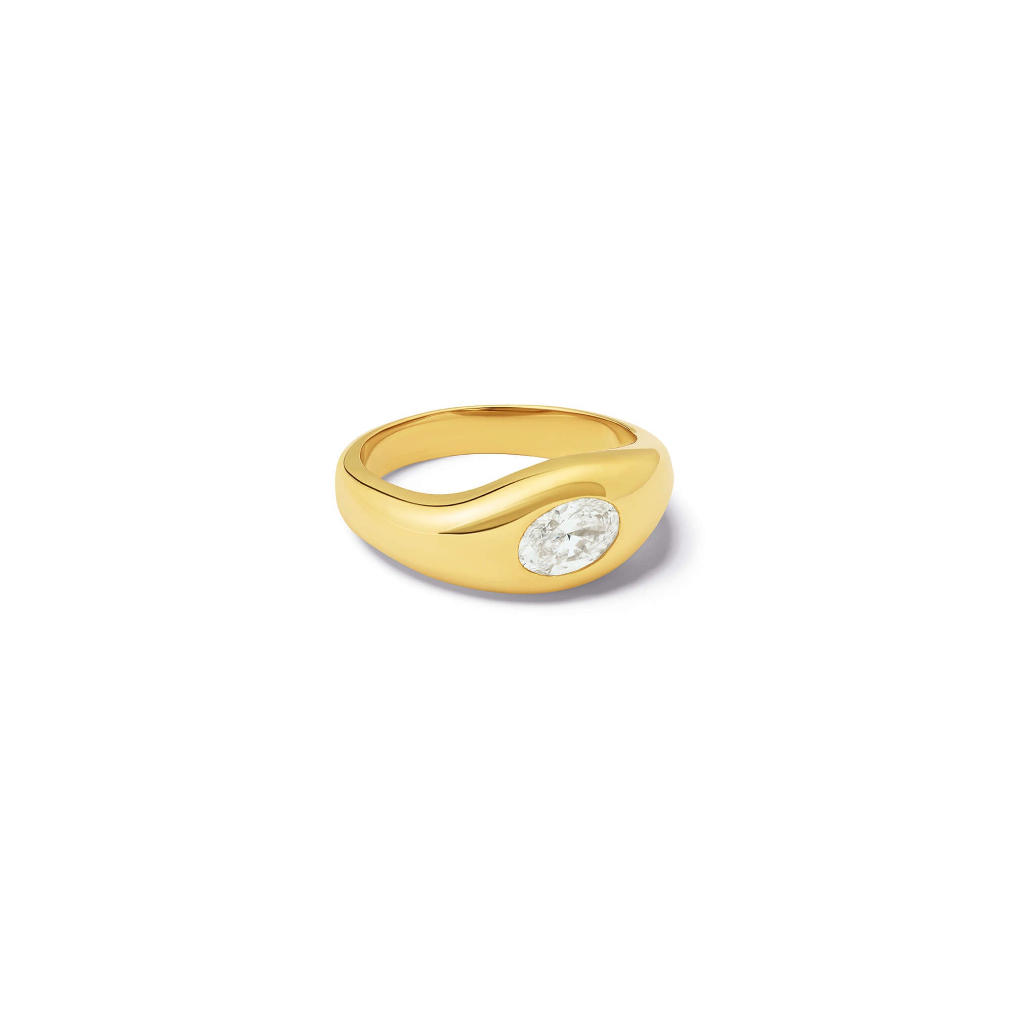 Handcrafted yellow gold ring with a slight teardrop design set with an oval facetted diamond.