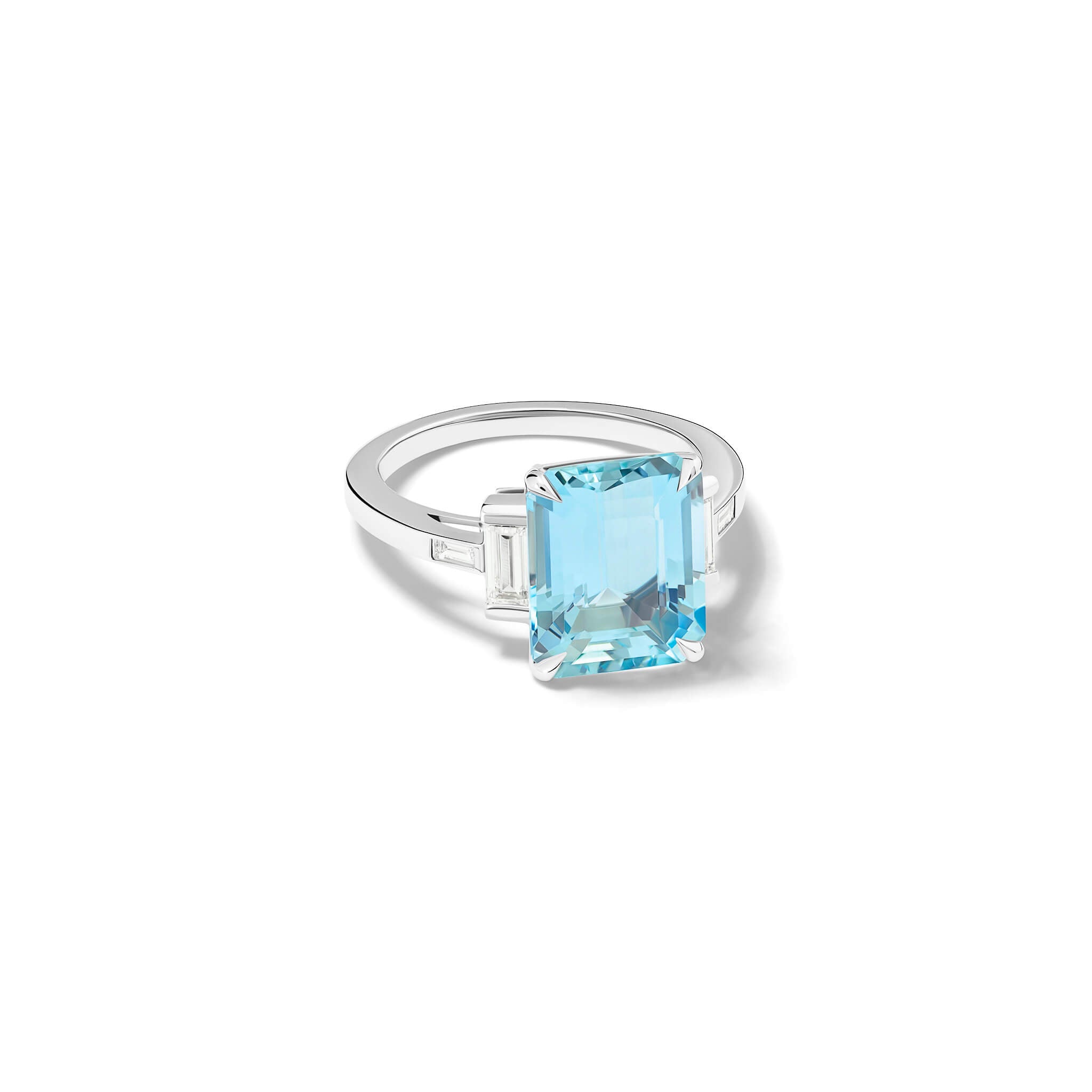 Handcrafted platinum ring featuring a central emerald cut blue aquamarine flanked by two smaller rectangular diamonds on each side and a pair of baguette cut diamonds, all set in a sleek band.