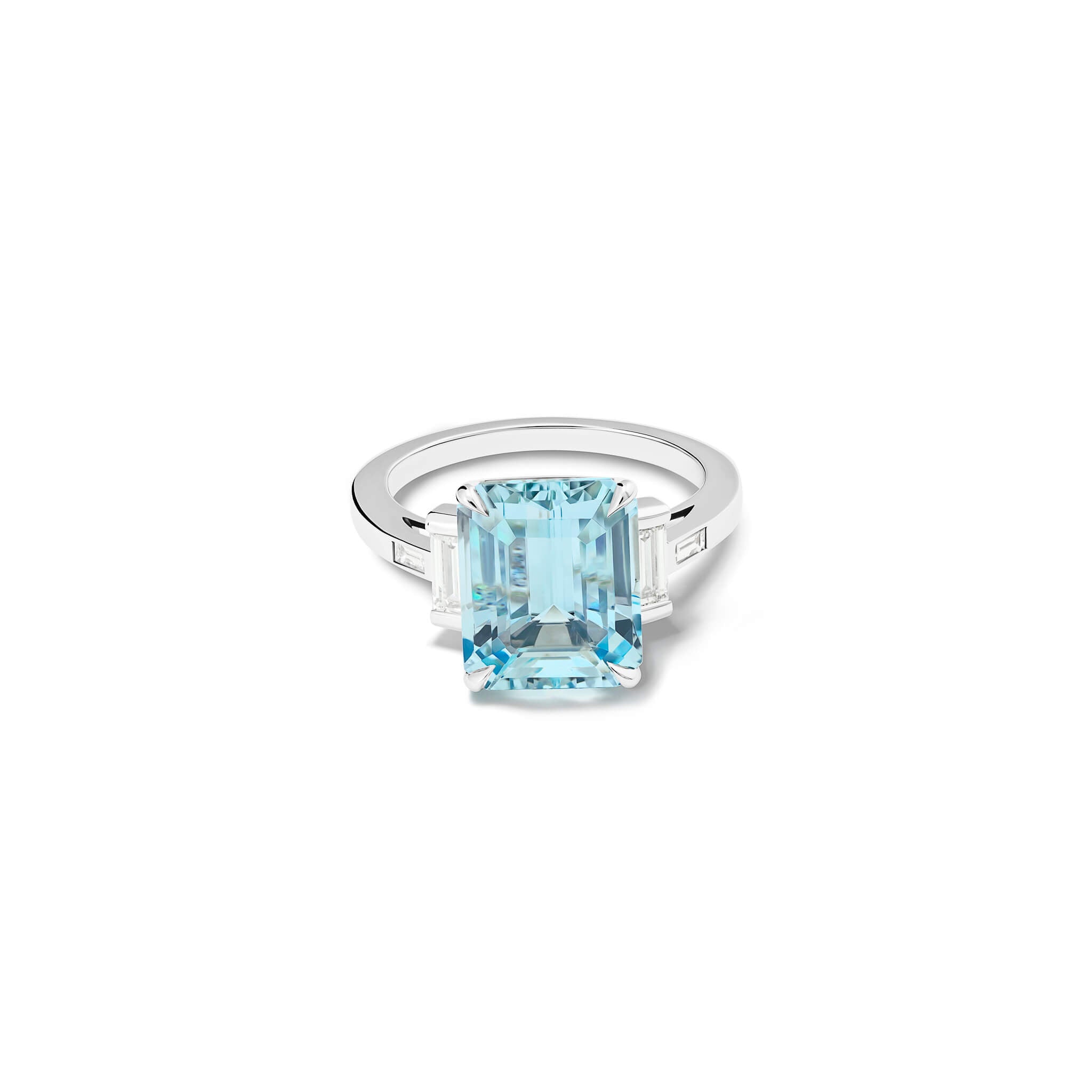 Handcrafted platinum ring featuring a central emerald cut blue aquamarine flanked by two smaller rectangular diamonds on each side and a pair of baguette cut diamonds, all set in a sleek band.