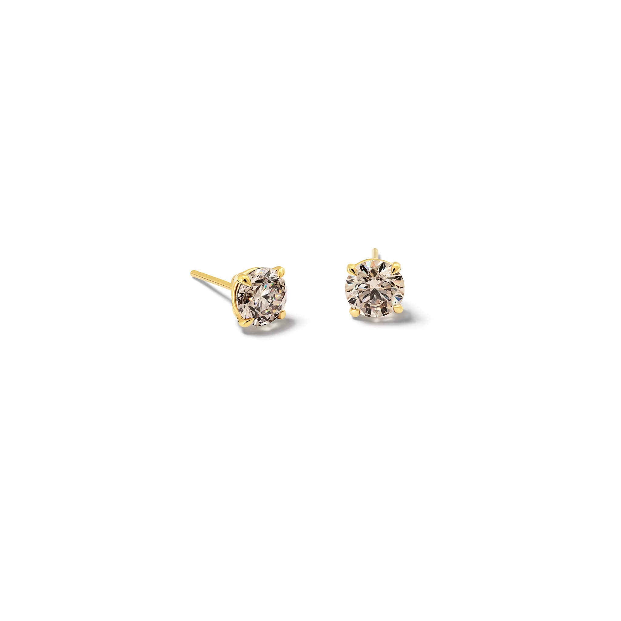 Handcrafted 18ct yellow gold interchangeable stud earrings featuring round brown diamond, the birthstone of April.