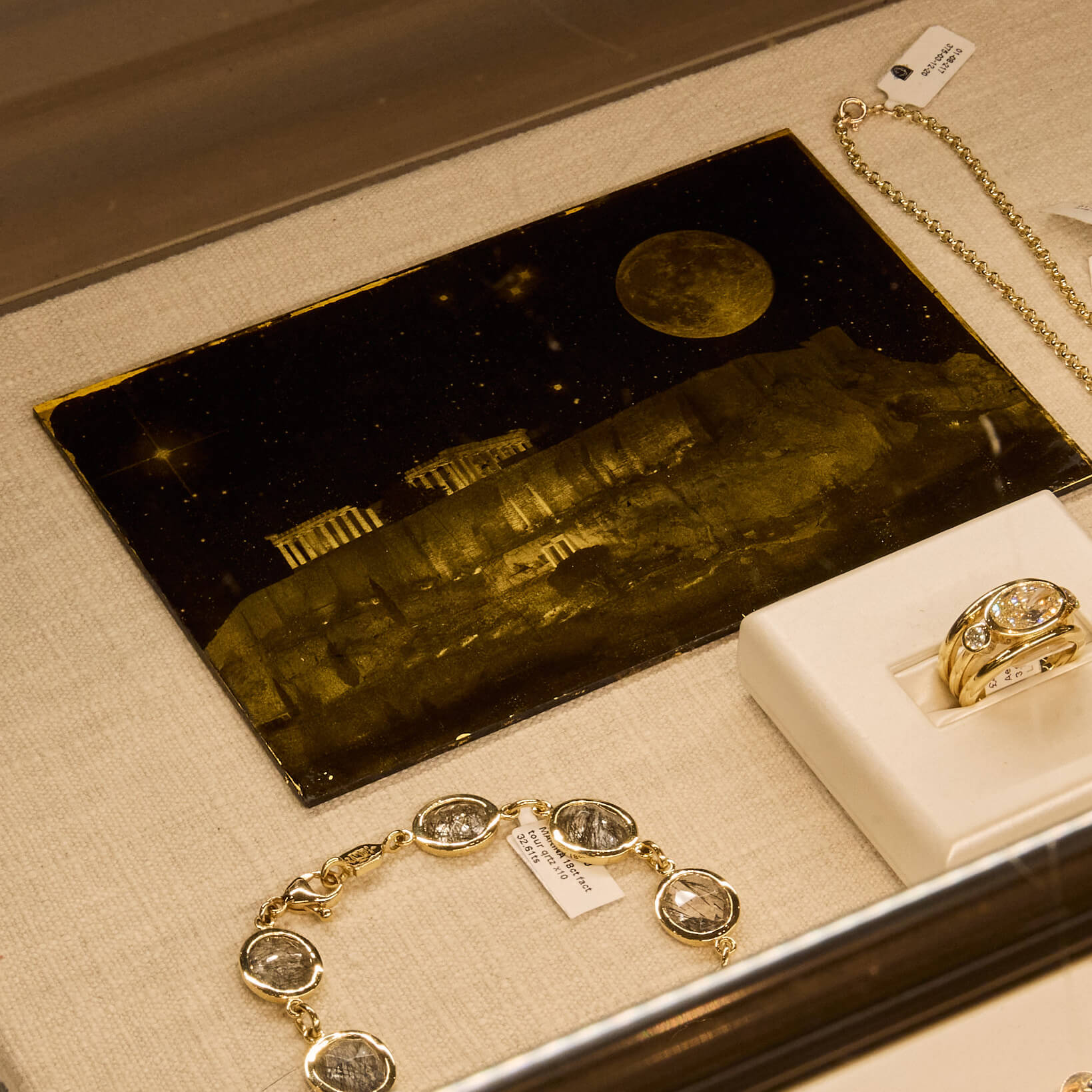 Cassandra Goad boutique display of jewels featuring Fran May's art work. 