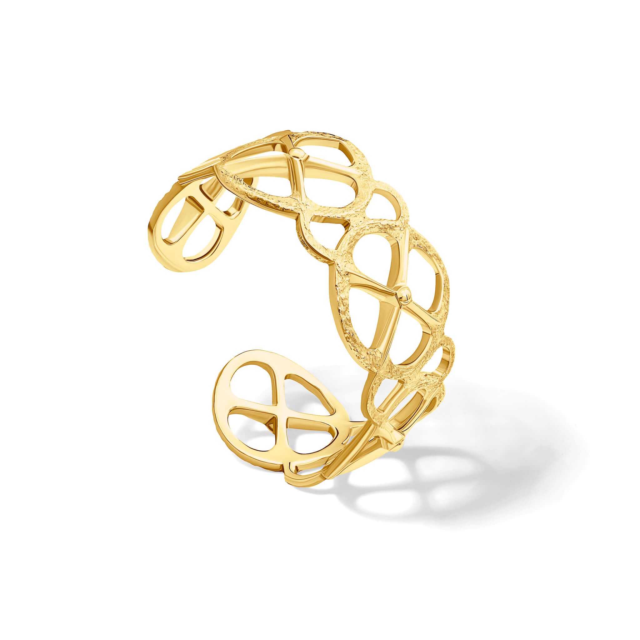 Handcrafted yellow gold cuff bracelet with a circular motif and a cross in the middle.