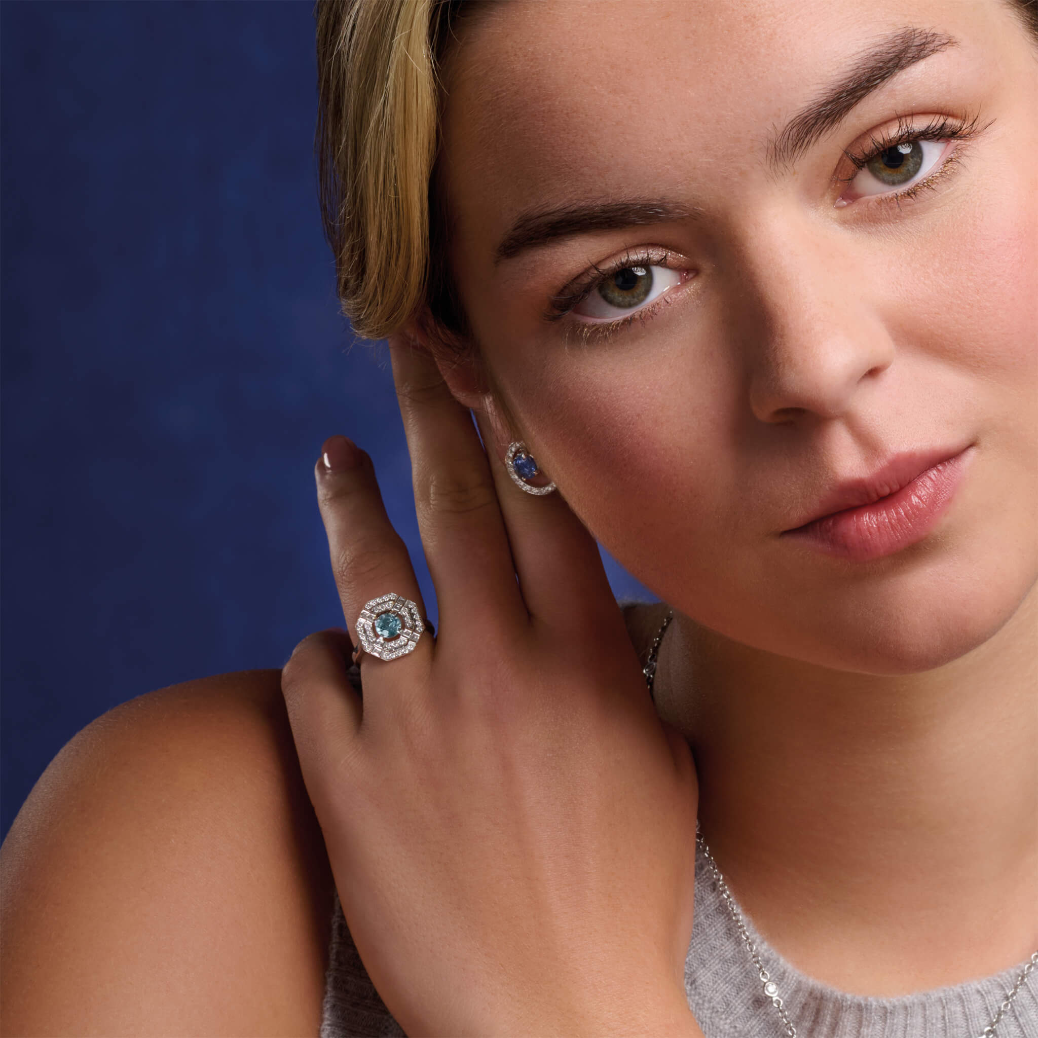 Heloise engagement ring with aquamarine and diamond.