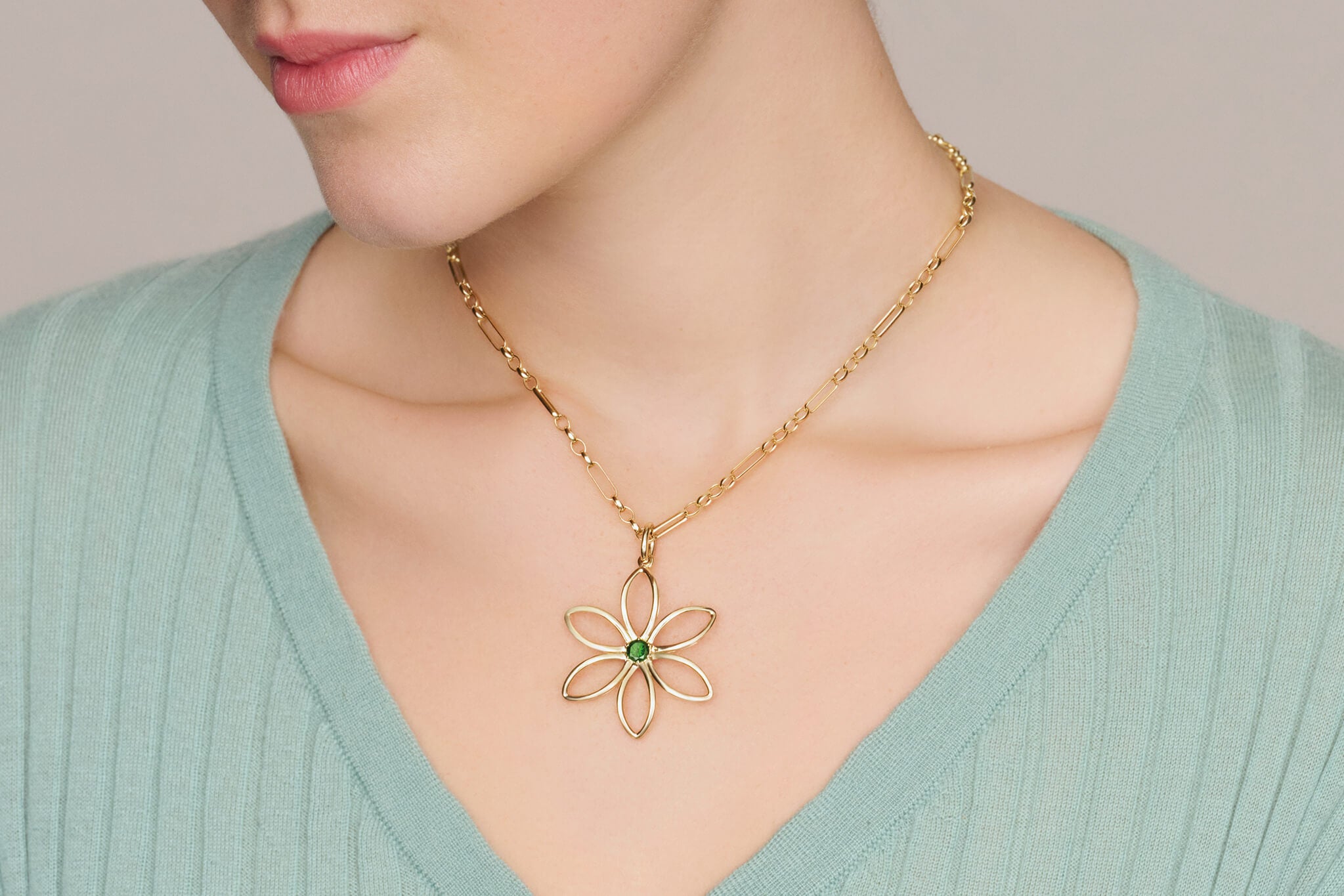 Model wearing Fleur de Lys necklace pendant.