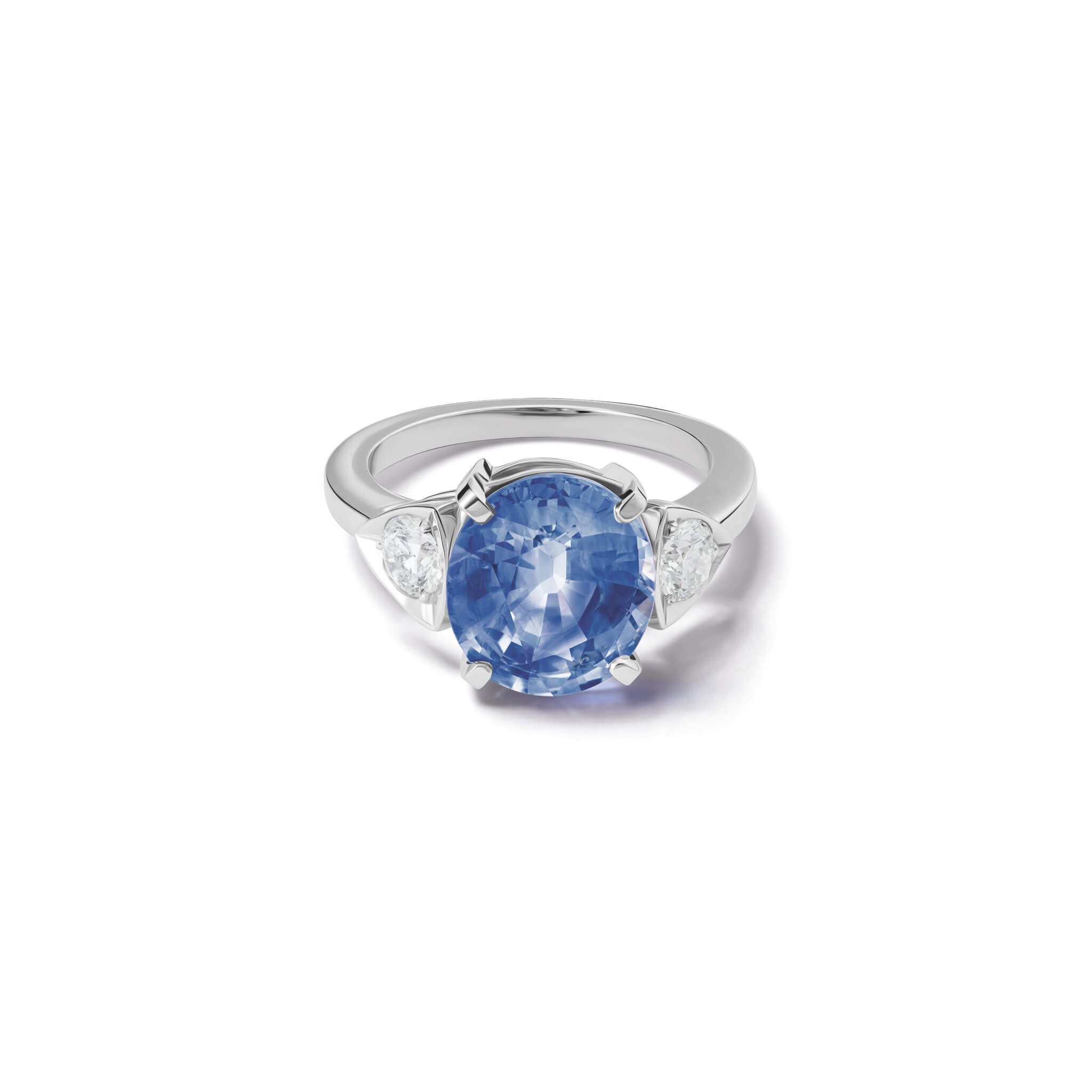 Handcrafted 18ct white gold engagement ring featuring a large central oval sapphire flanked by one smaller teardrop-shaped diamond on each side.