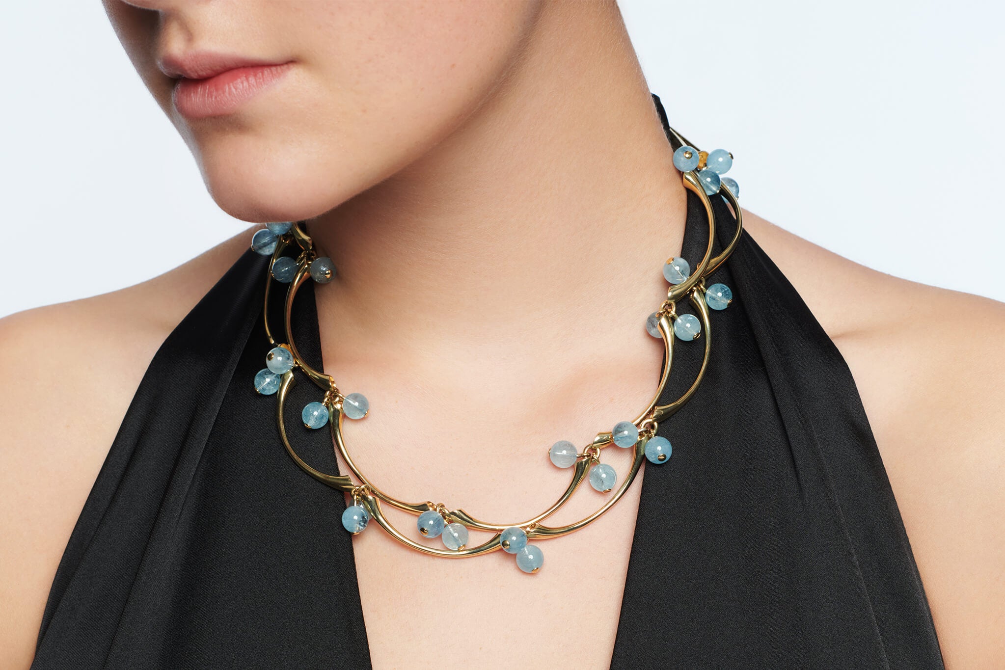 Model wears Kerala necklace from India collection