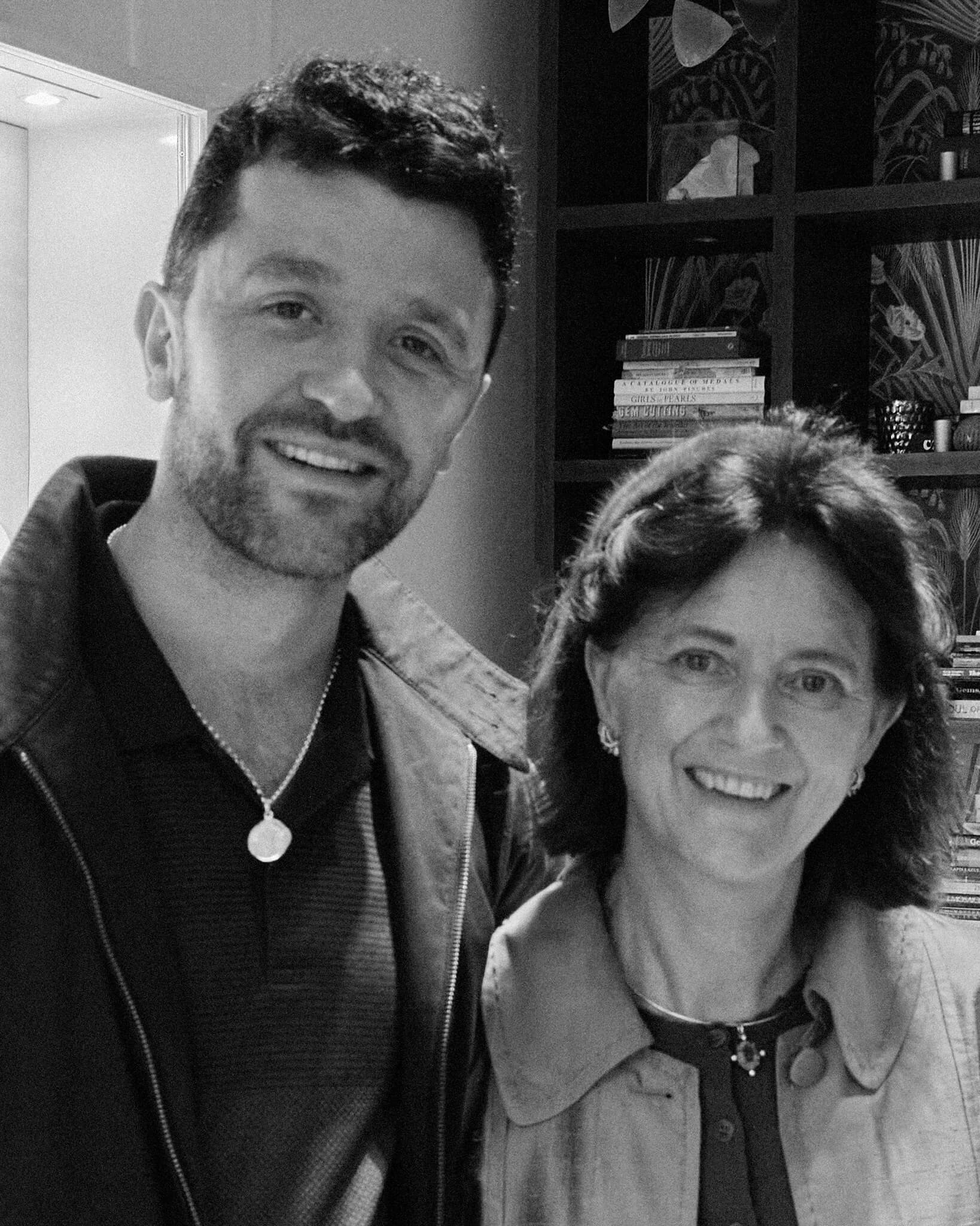 Max Worsley and Cassandra Goad, Max is wearing the Onwards quote pendant in silver.