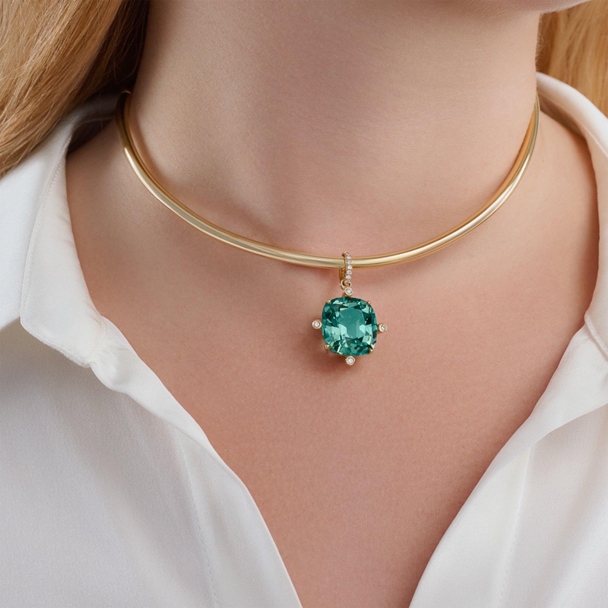 Model wearing handcrafted Compass extra large pendant with mint tourmaline set with four diamonds on yellow gold zola necklace, october birthstone
