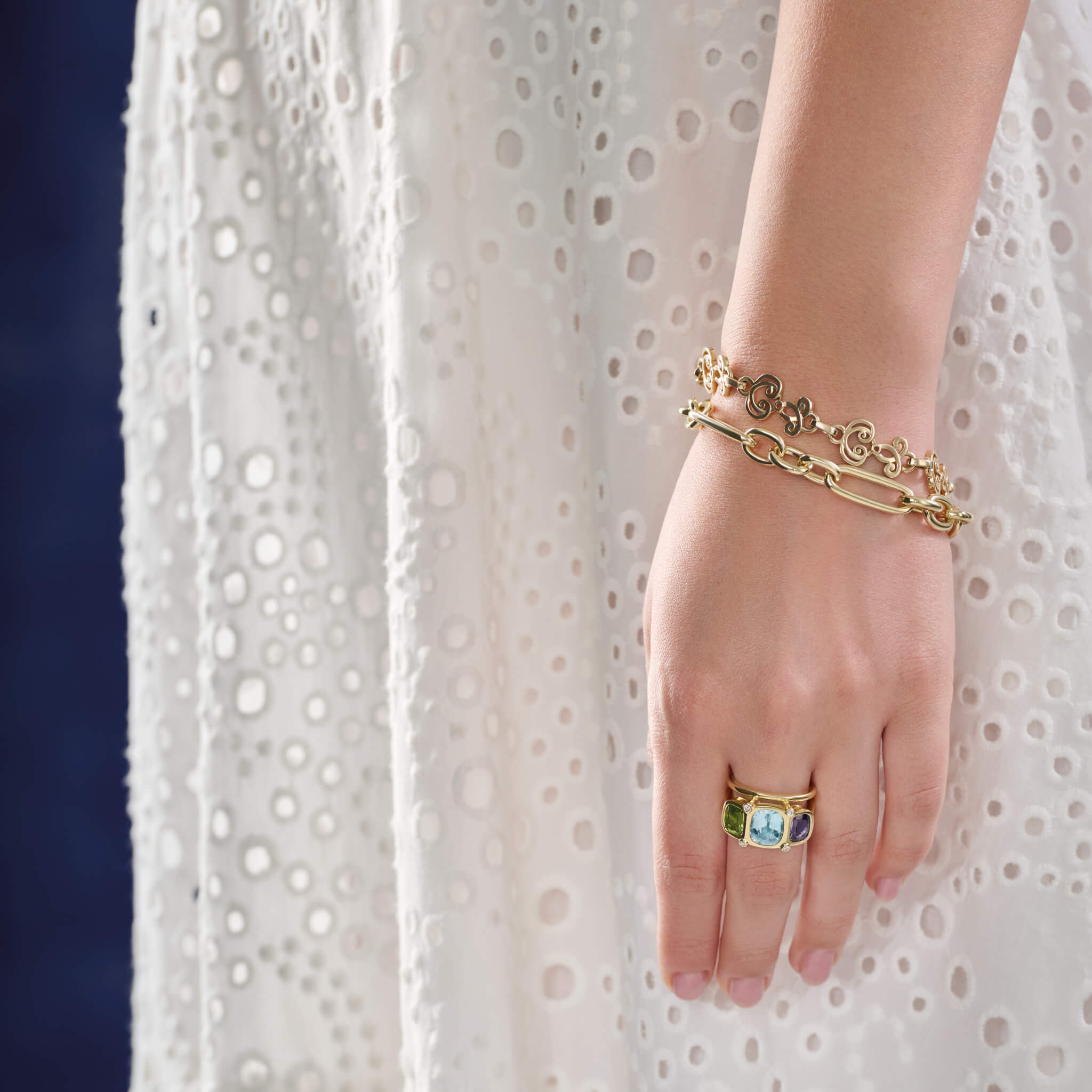 Model wearing handcrafted yellow gold bracelet featuring ironwork motifs from the stables in France.