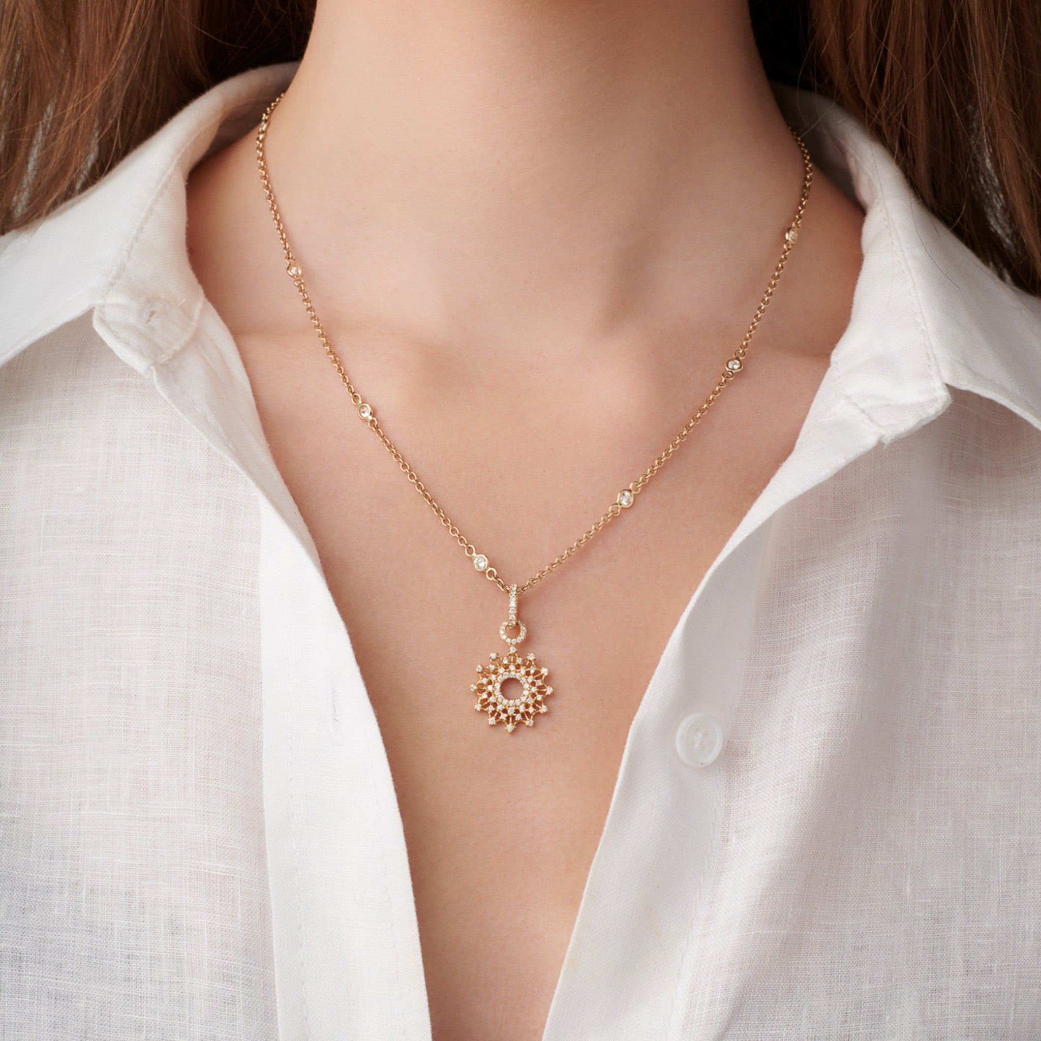 model wears handcrafted La Martorana Mosaic pendant in 18ct yellow gold with diamond inspired by Palermo’s intricate church mosaics.