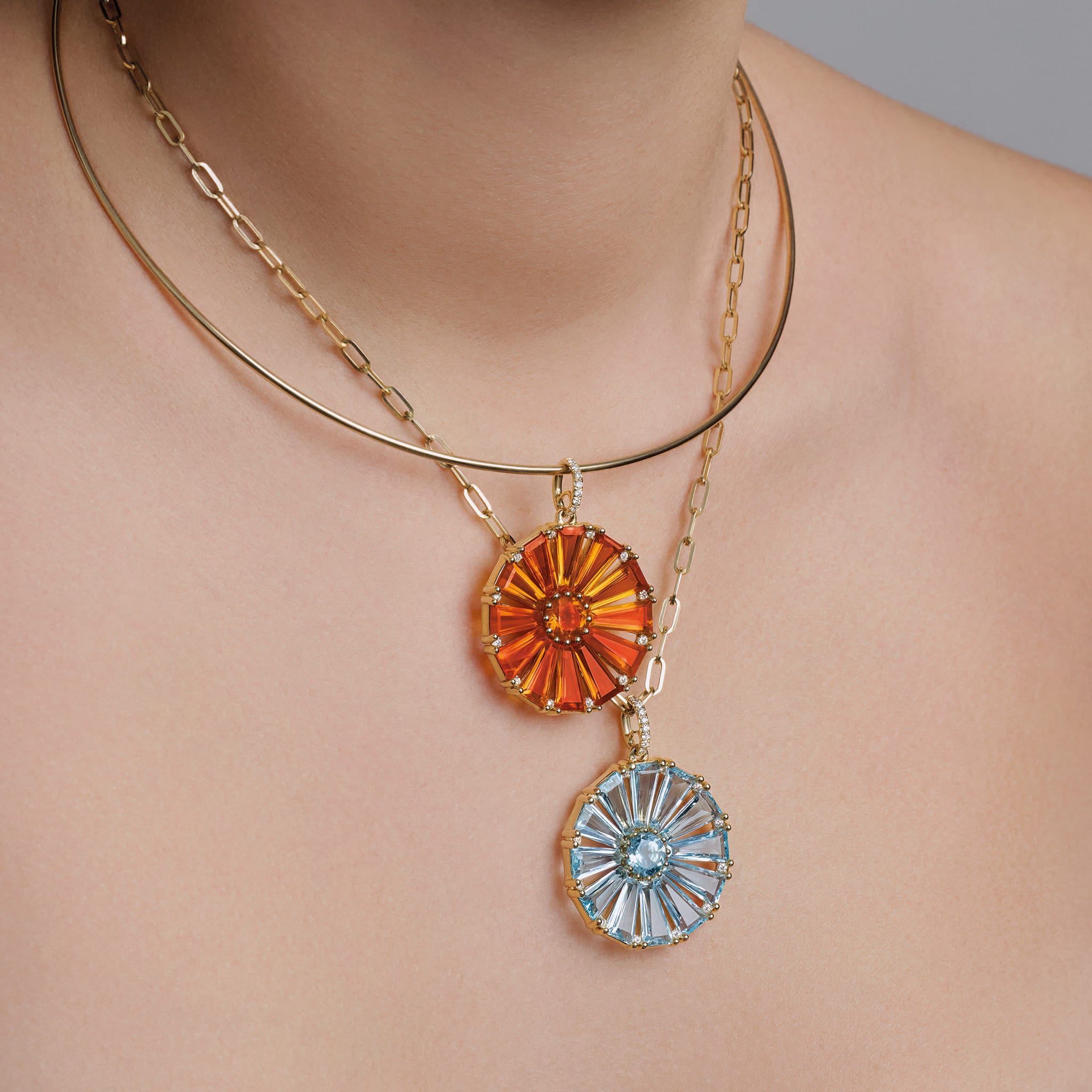 Model wears Roi Soleil necklace pendants