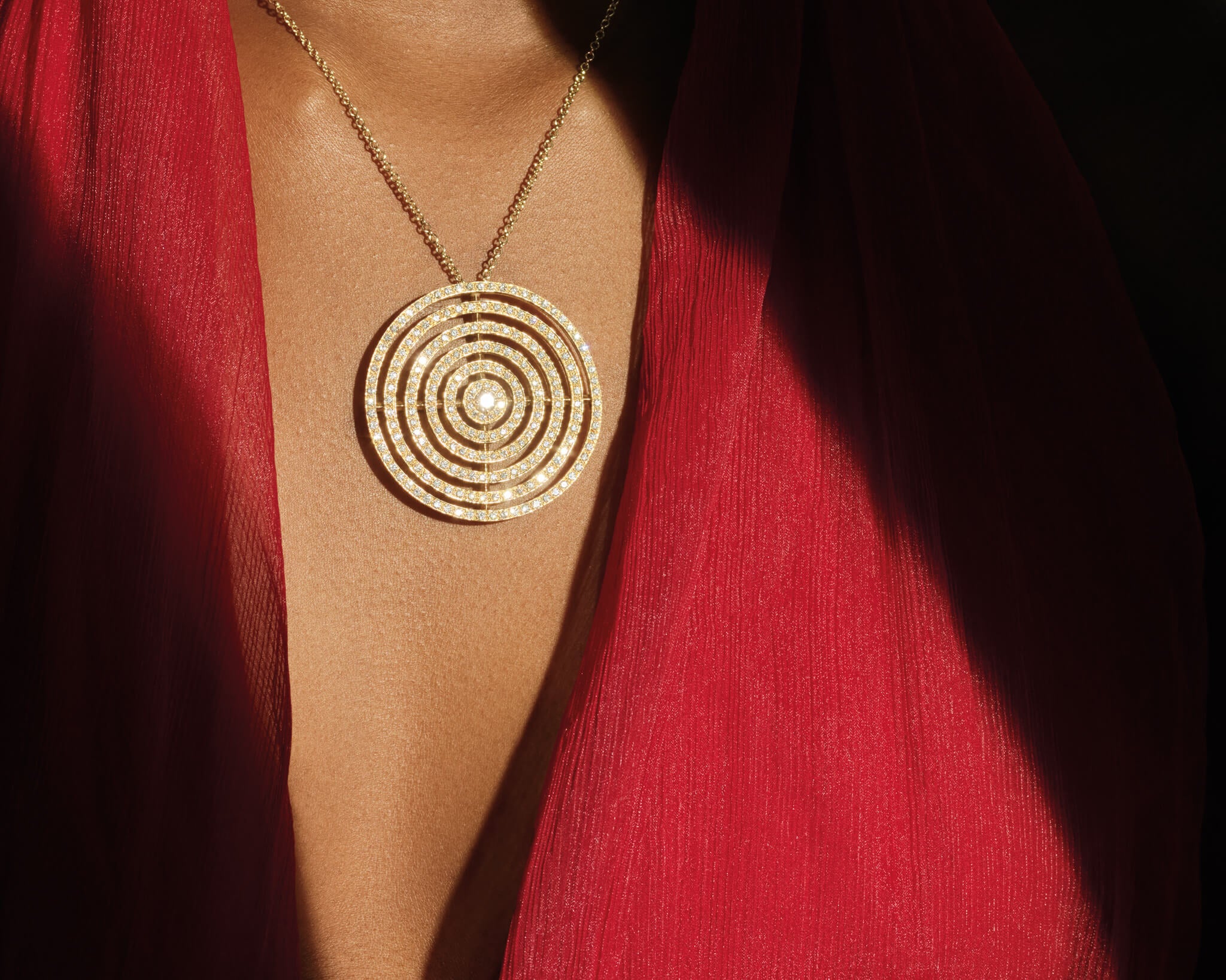 Model wears the Niremius 5 row pendant in 18ct yellow gold with diamonds