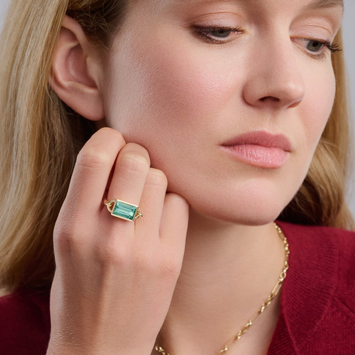 Model wears handcrafted Baguette ring in 18ct yellow gold