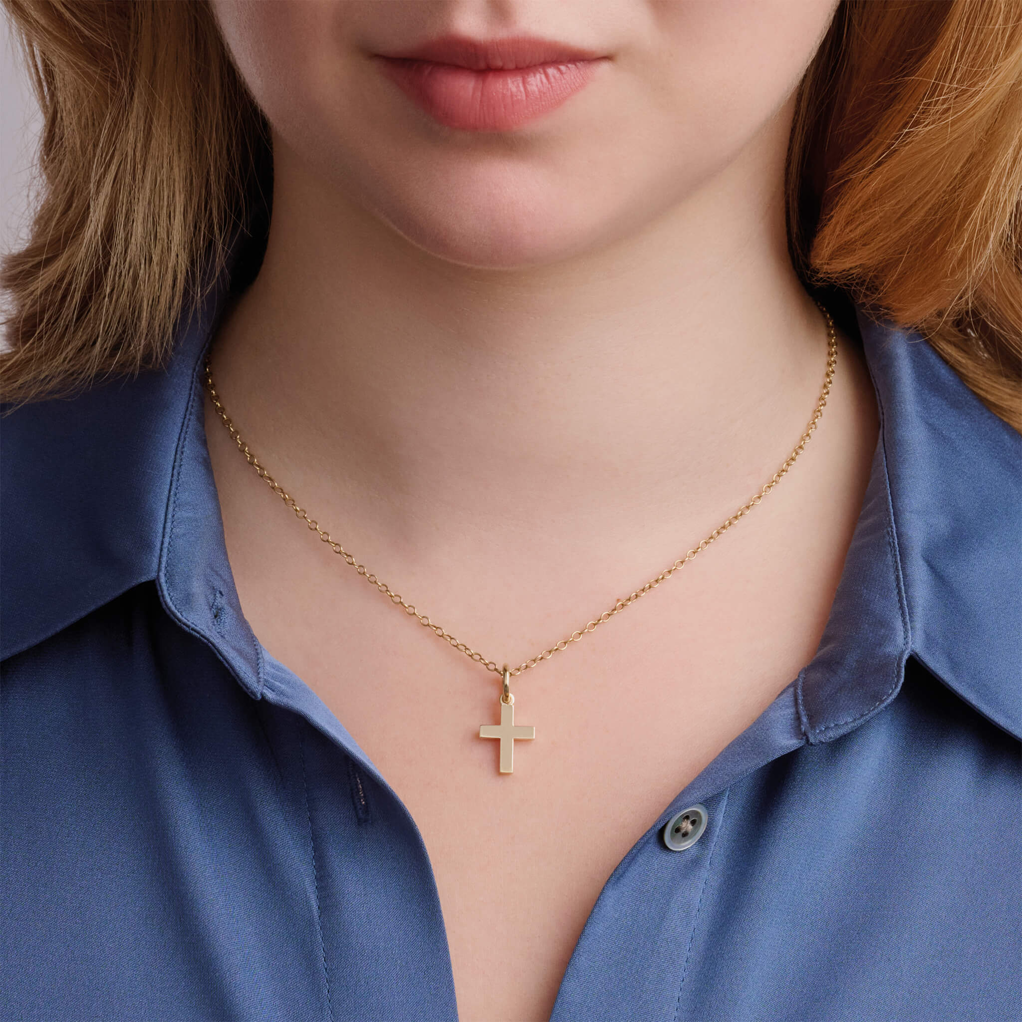 Handcrafted yellow gold cross shaped necklace pendant.