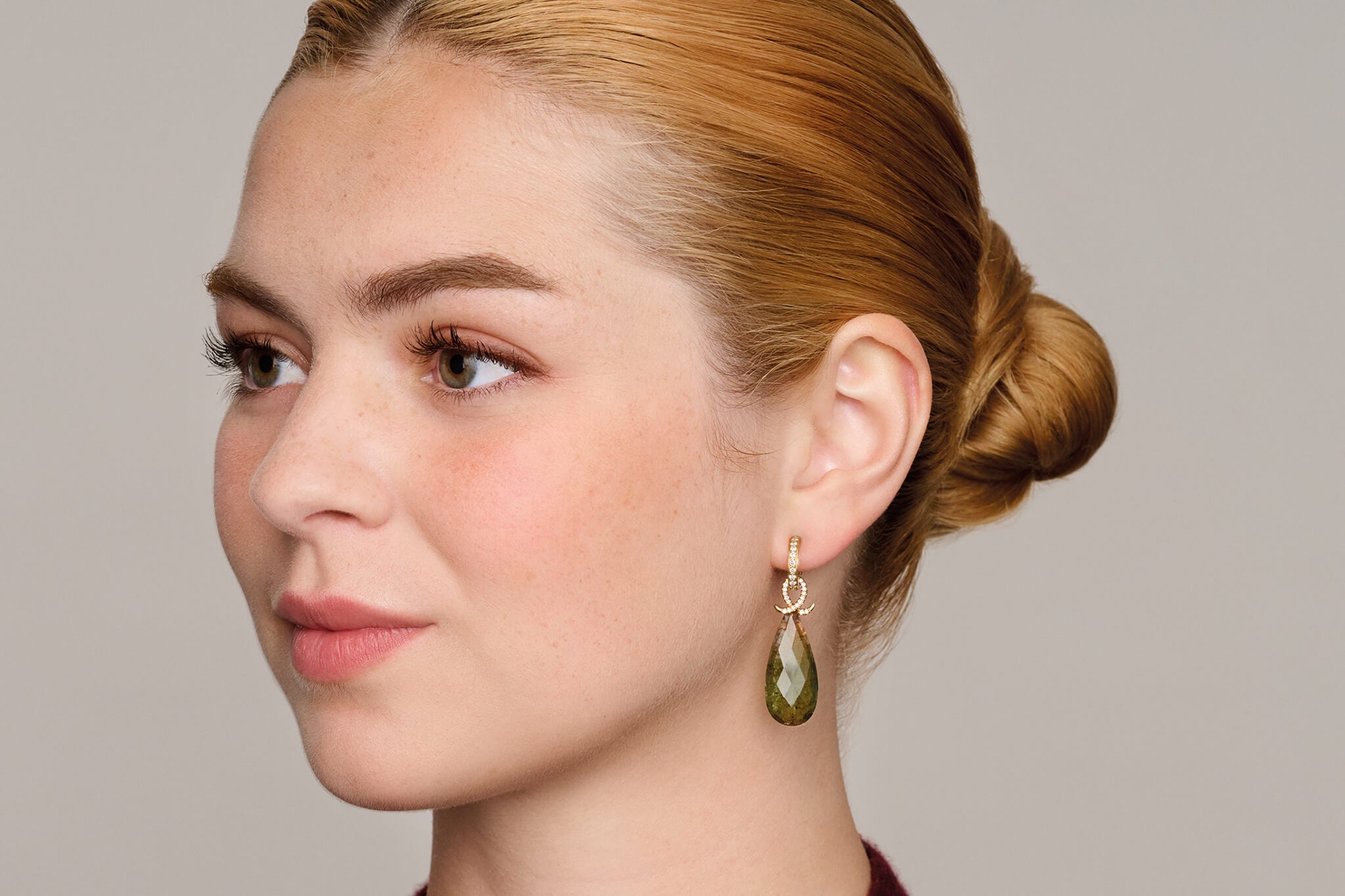 Model wearing watermelon tourmaline Icarus drops.