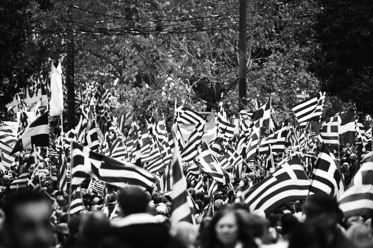 greek celebration with greek flags black and white