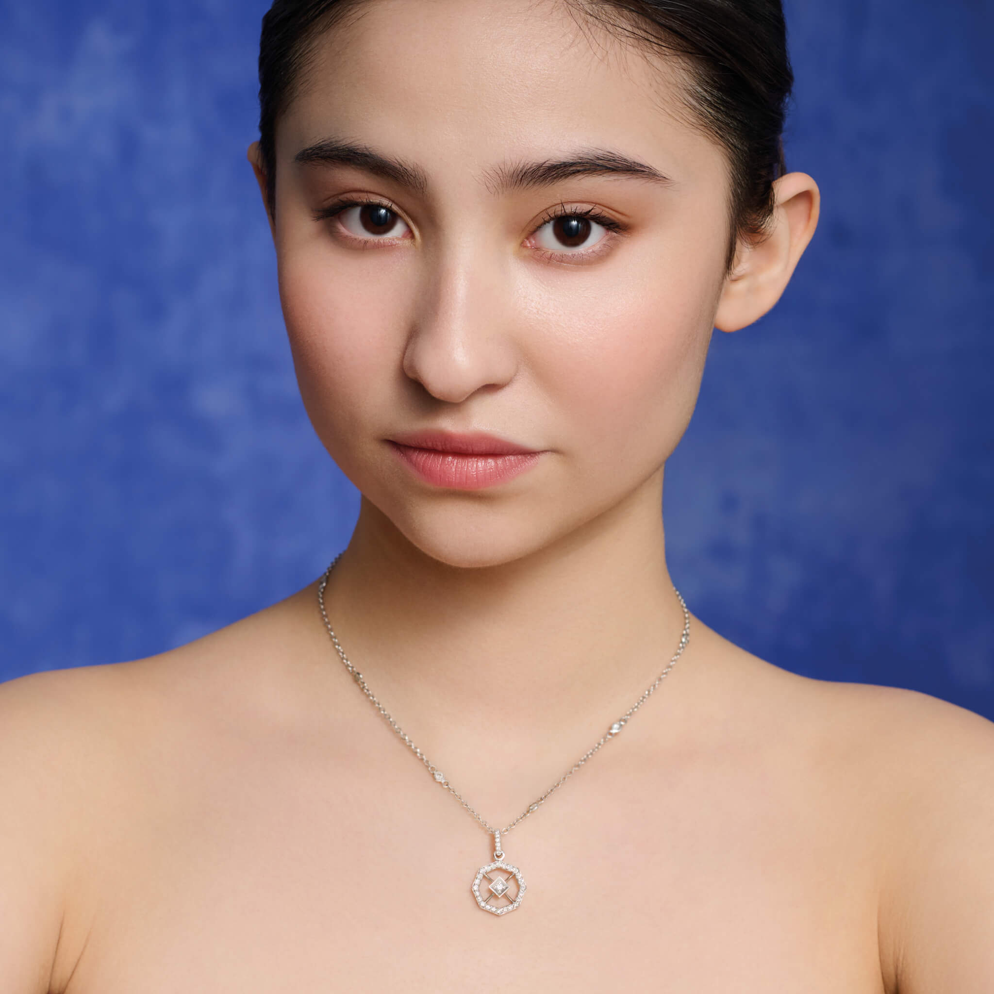 Model wears Cassandra Goad Parquet small necklace pendant in diamond. 