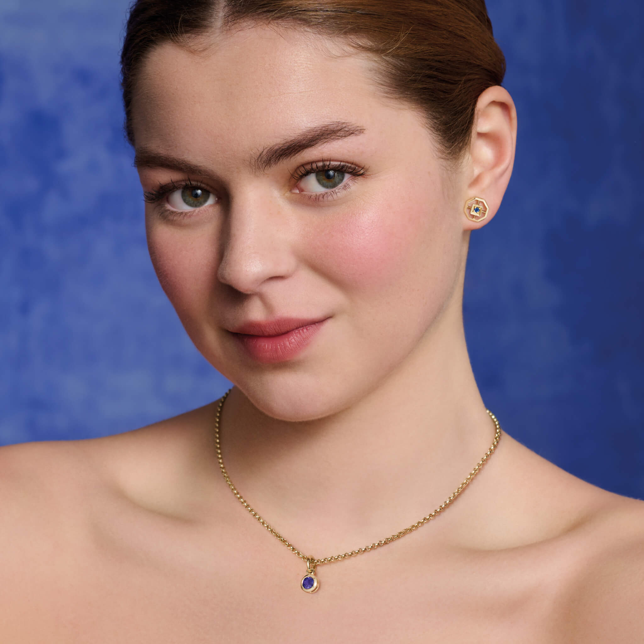 Model wears Cassandra Goad Parquet studs in sapphire.