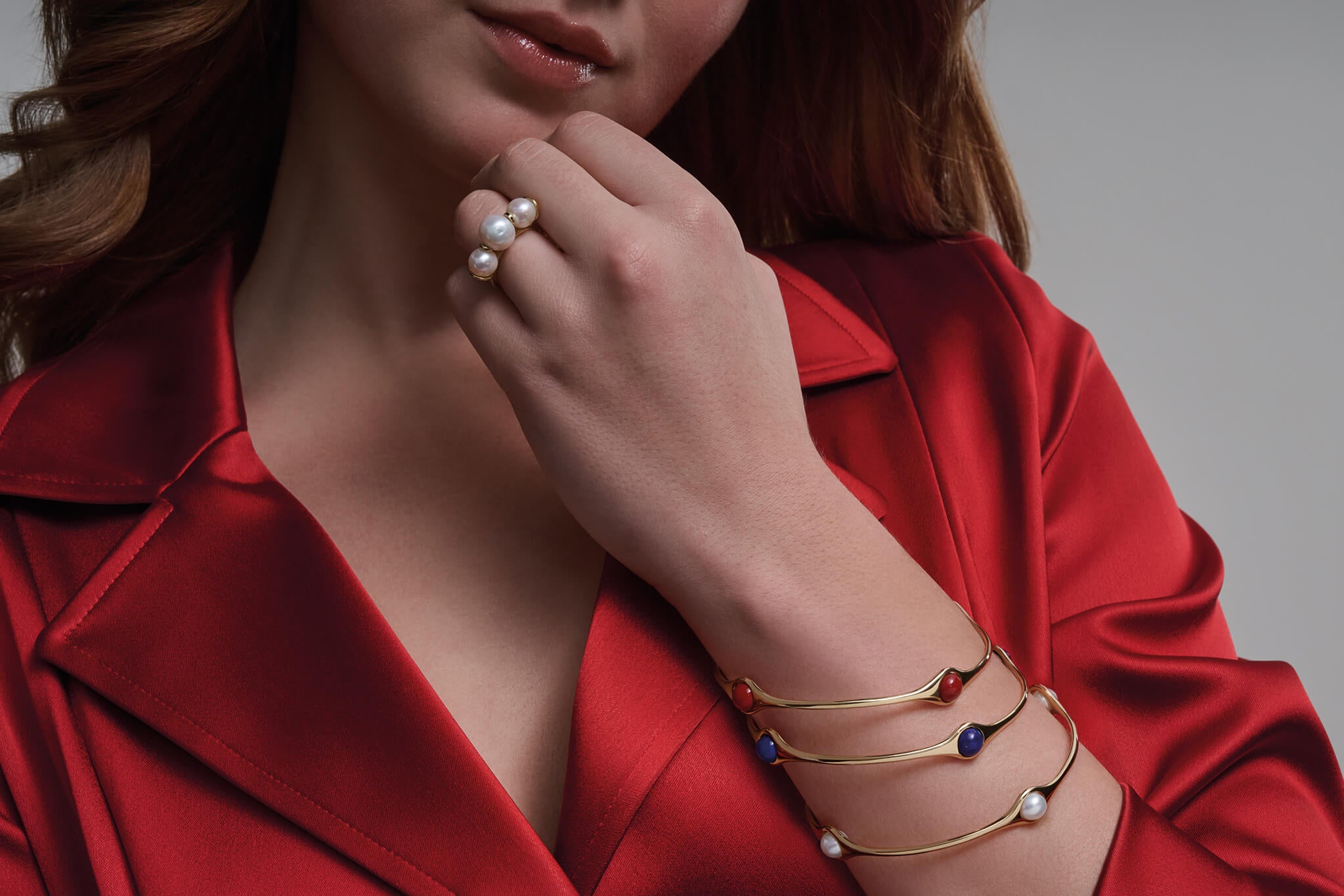 Model wearing Persephone ring and stacked bangles