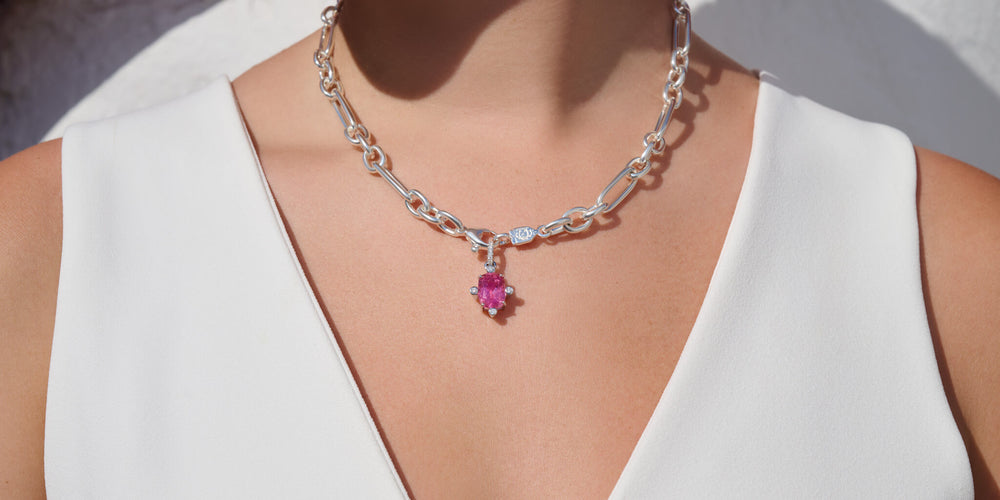 Model wears Cassandra Goad's pink tourmaline compass necklace pendant white gold. 