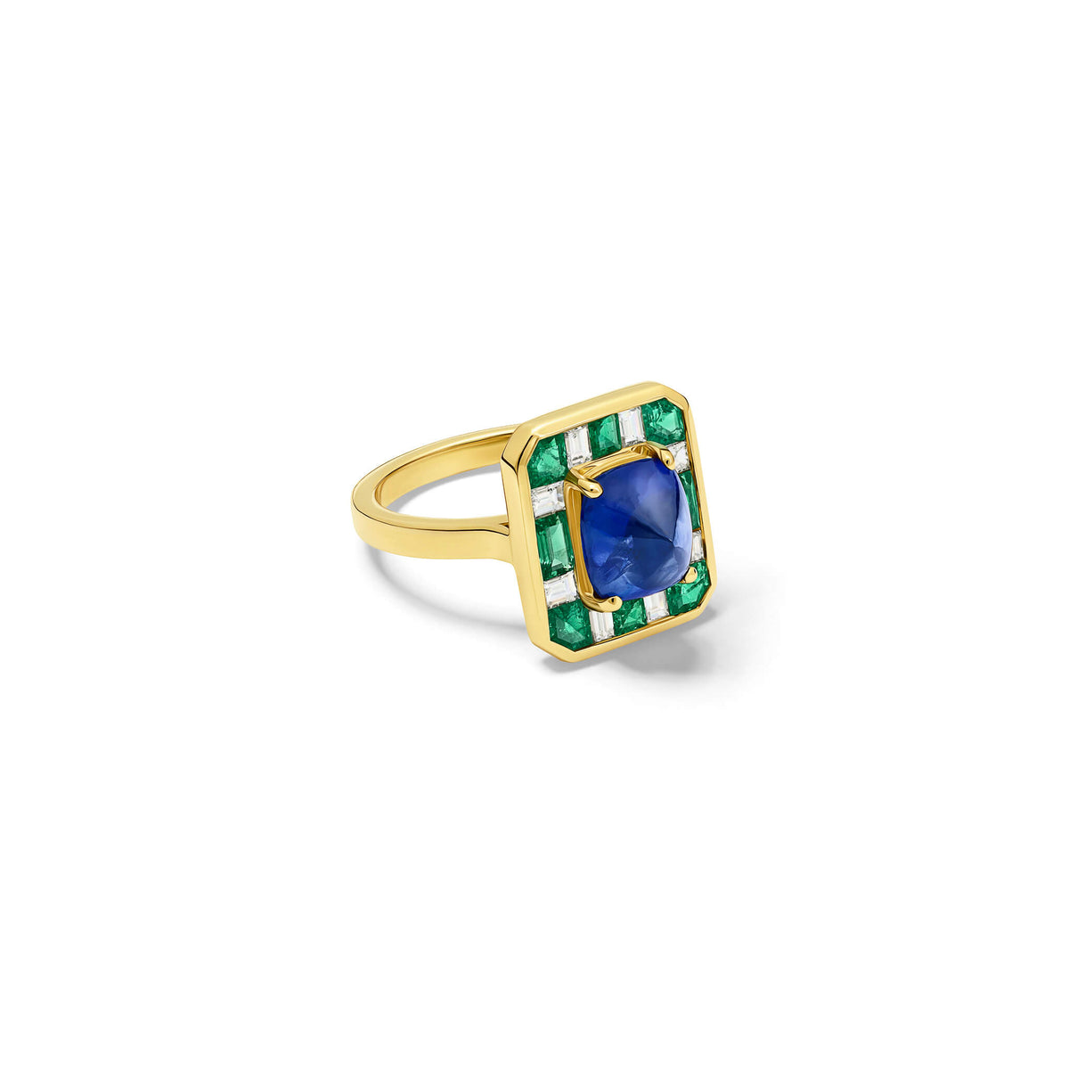 Handcrafted 18ct yellow gold ring featuring a central sugarloaf blue sapphire from Madagascar surrounded by square cut emeralds and baguette cut diamonds.