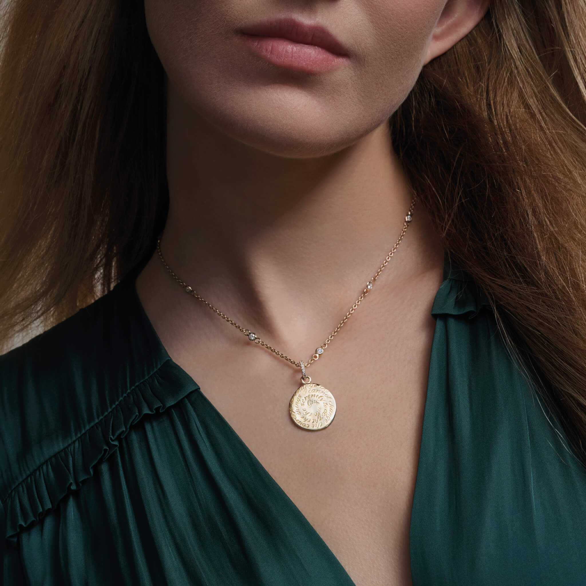 model wearing handcrafted engravable quote pendant 