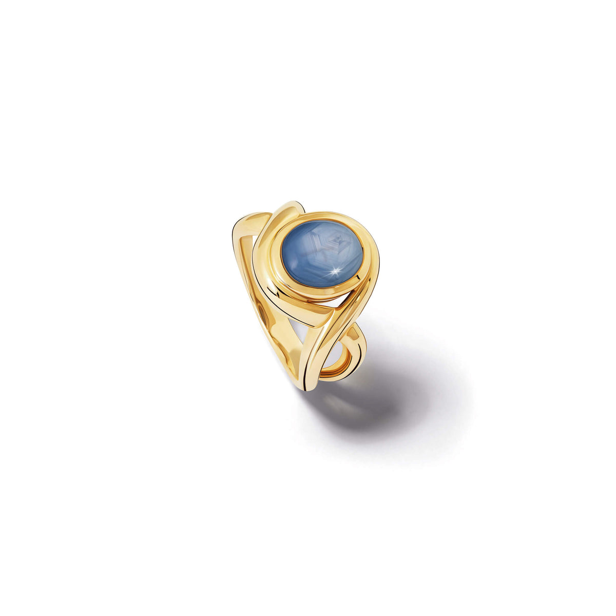 Handcrafted 9ct yellow gold ring featuring curved shanks with a round cabochon star sapphire, September birthstone.
