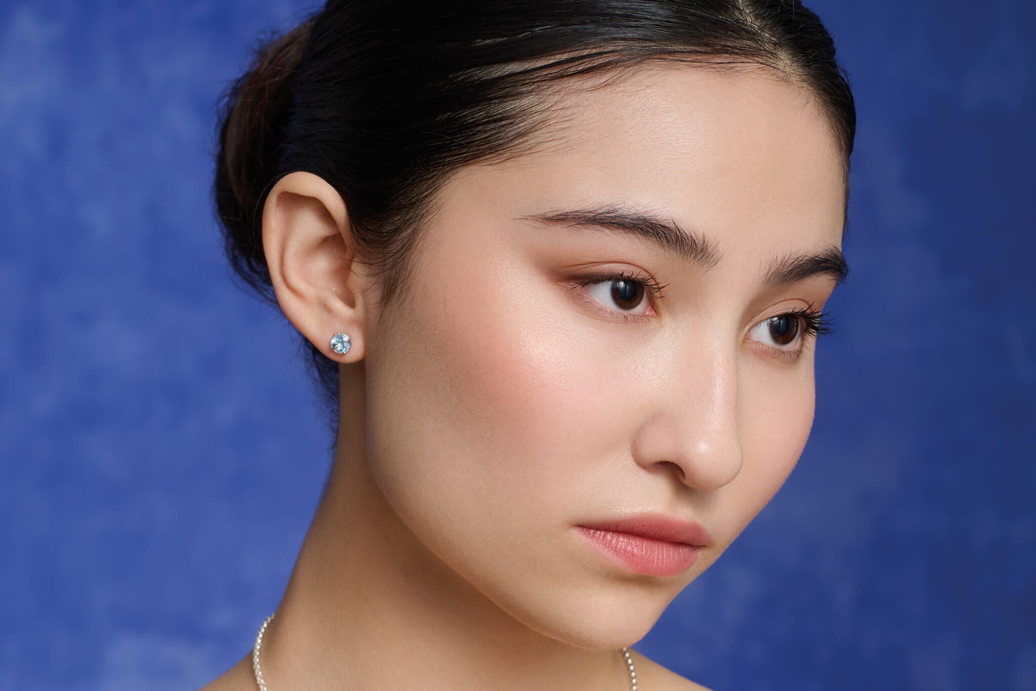 Model wearing finita studs.