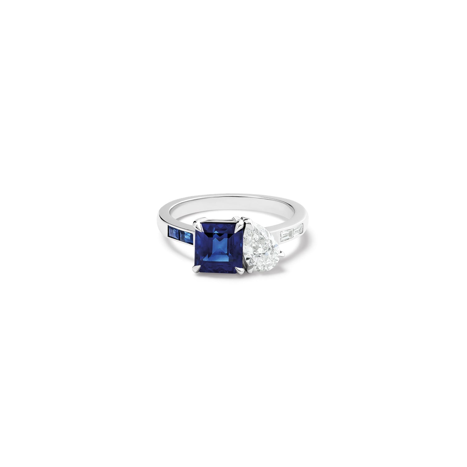 Handcrafted 18ct white gold ring featuring a blue sapphire with diamond.
